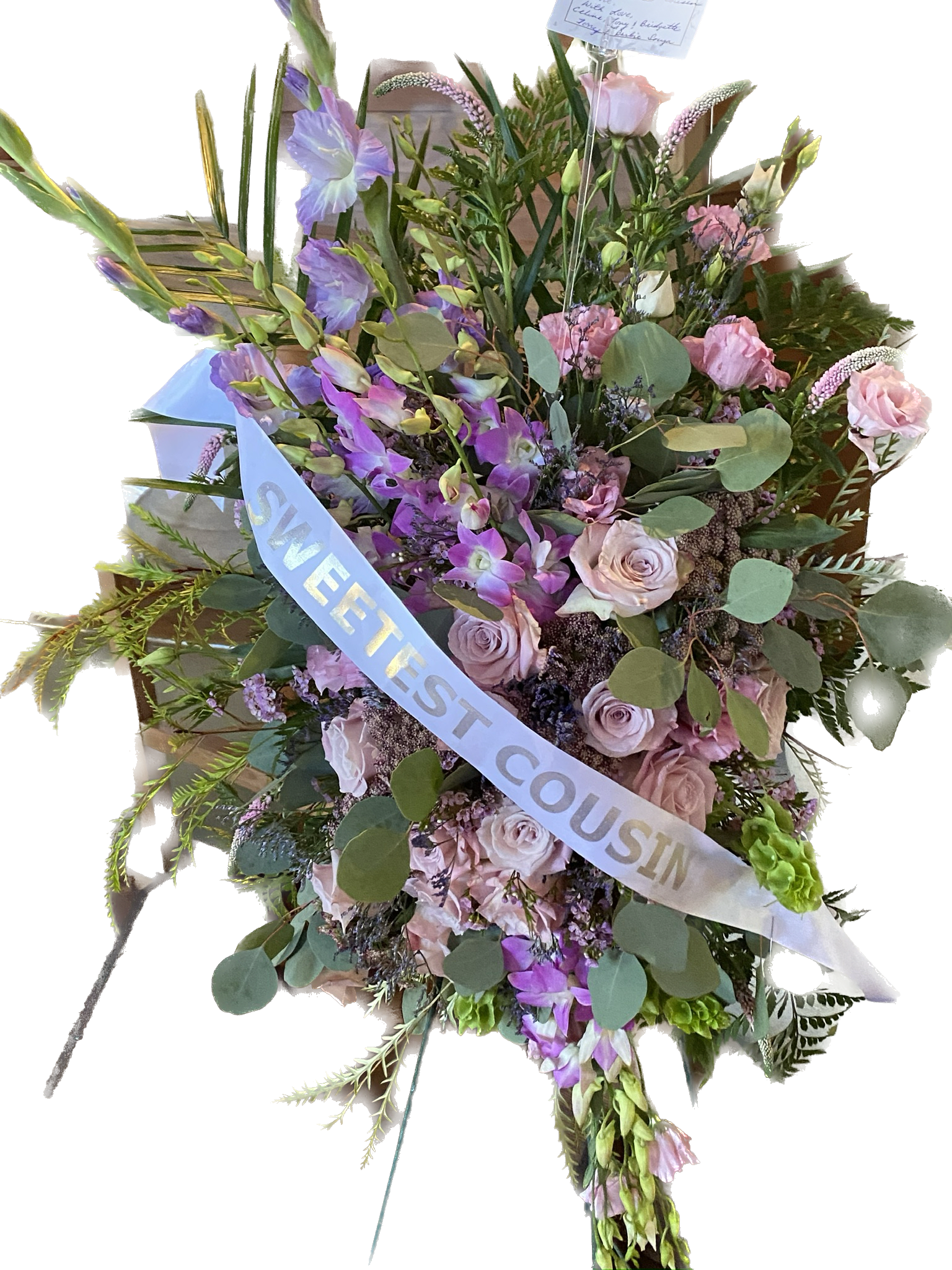 Compassion - Purple orchids, gladiolus, and more come together for a beautiful purple and pink standing funeral spray. 