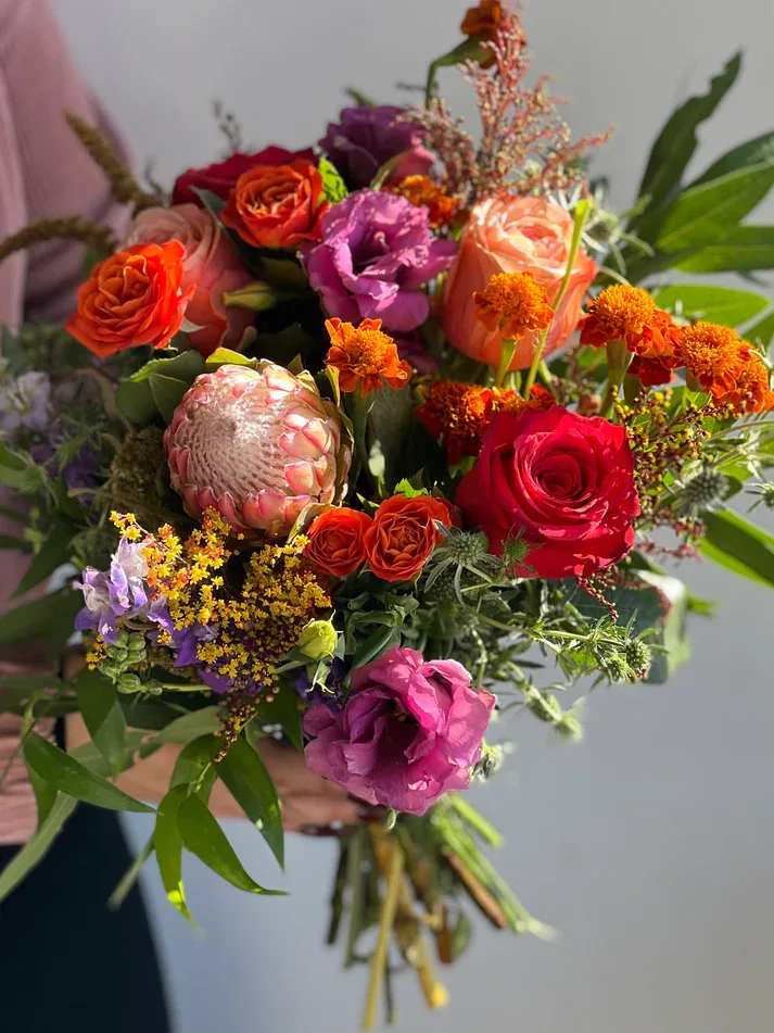Seasonal Designers Choice Bouquet - Designers' choice bouquets will all vary in design, color &amp; style, using a seasonal blend of florals with accented greens &amp; fillers. If any aspect of this bouquet is of importance, (ex: colors, flower type) please leave a request in the special instructions &amp; we will try our best to honor this depending on seasonality &amp; market availability.  155 W. First St. Tustin, CA. 92780 (714) 368-9845  Monday 8 a.m. - 4 p.m. Tues-Fri 8 a.m. - 6 p.m. Saturday 8 a.m. - 4 p.m. Sunday 10 a.m. - 2 p.m.