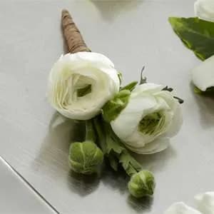 White Ranunculus Boutonniere - White Ranunculus Boutonniere gives a modern twist to the look of the groom and groomsmen on the wedding day or prom