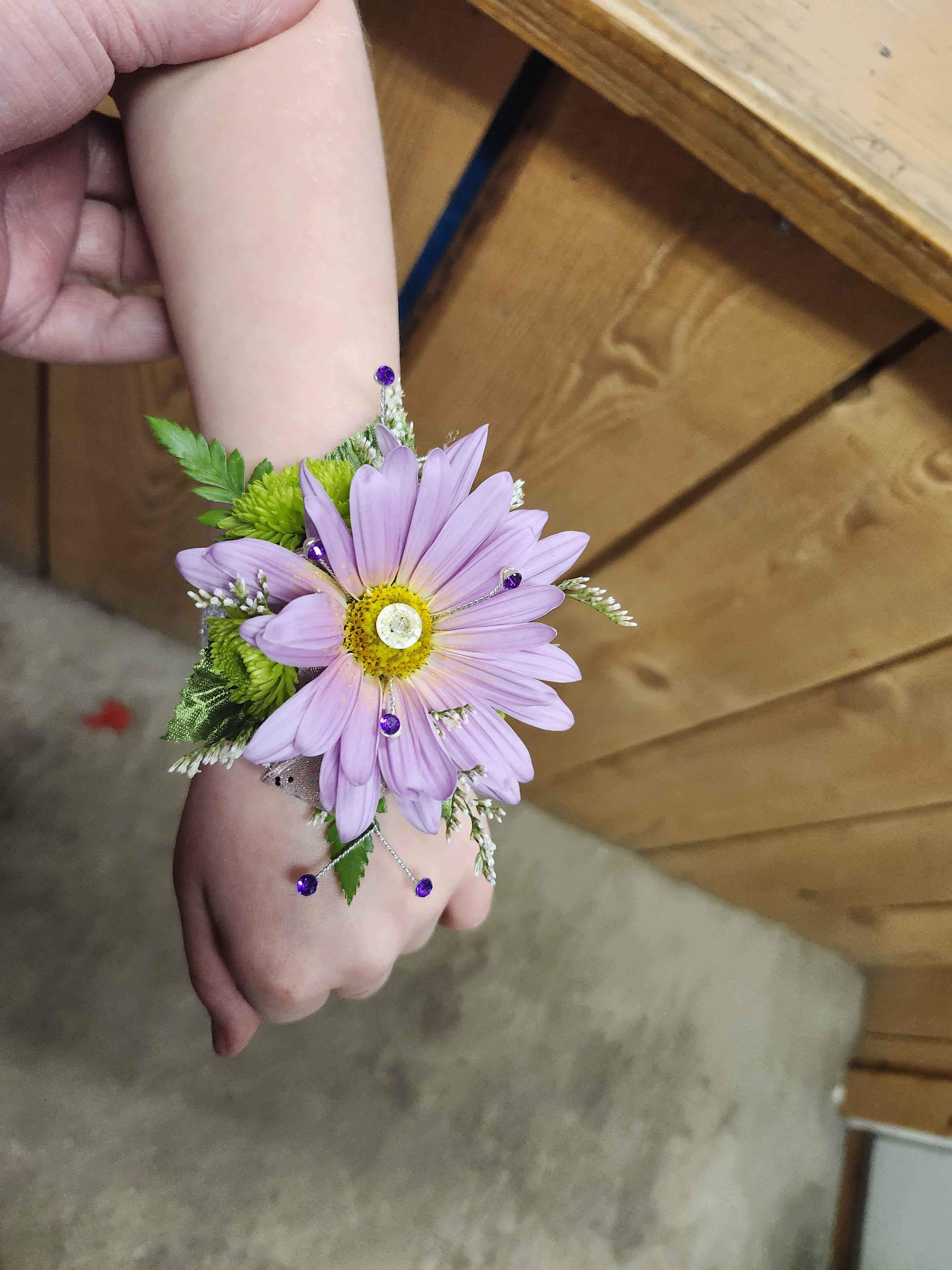 Kindergarten Graduation Corsage - These mini wrist corsages are the perfect accessory for graduation ceremonies, pictures, parties, and making your little one feel extra special on their big day. Each one can be customized with your choice of colors, flowers, ribbon, and sparkle accents to match outfits or school colors! Please put in comment section what flower type and colors you would like to be used.  Our example is the standard which features a soft lavender daisy with rhinestone accents for the perfect mix of fun and fancy.