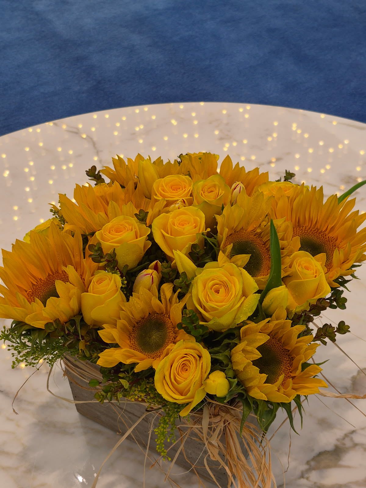 Sunny Days - A wood box of sunflowers roses and assorted flowers