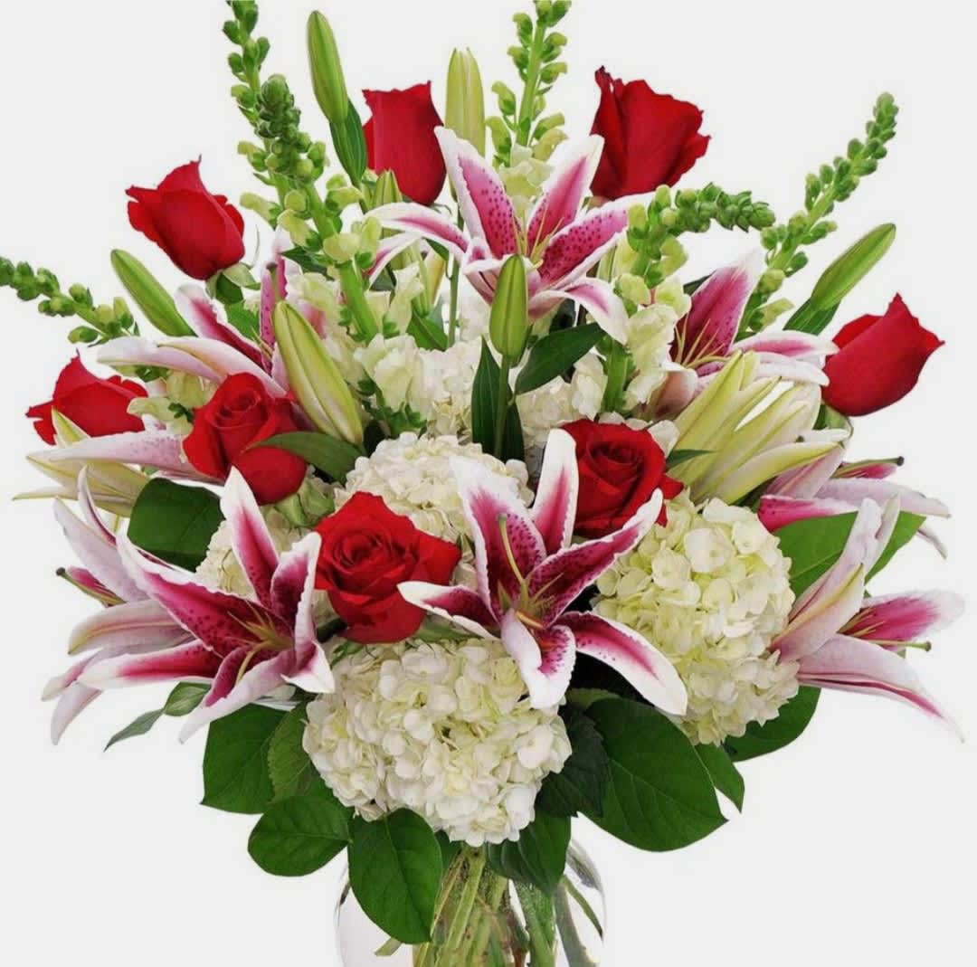 Bouquet of red roses, pink lilies, and white hydrangeas