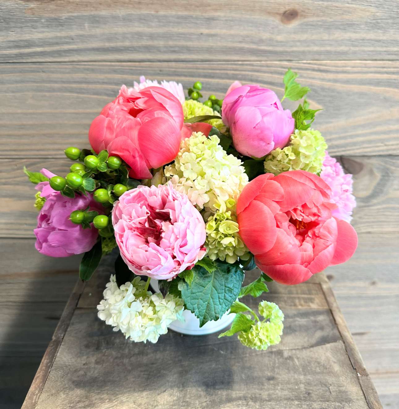 Peony Passion - A beautiful display showcasing seasonal peonies in a simple glass vase.