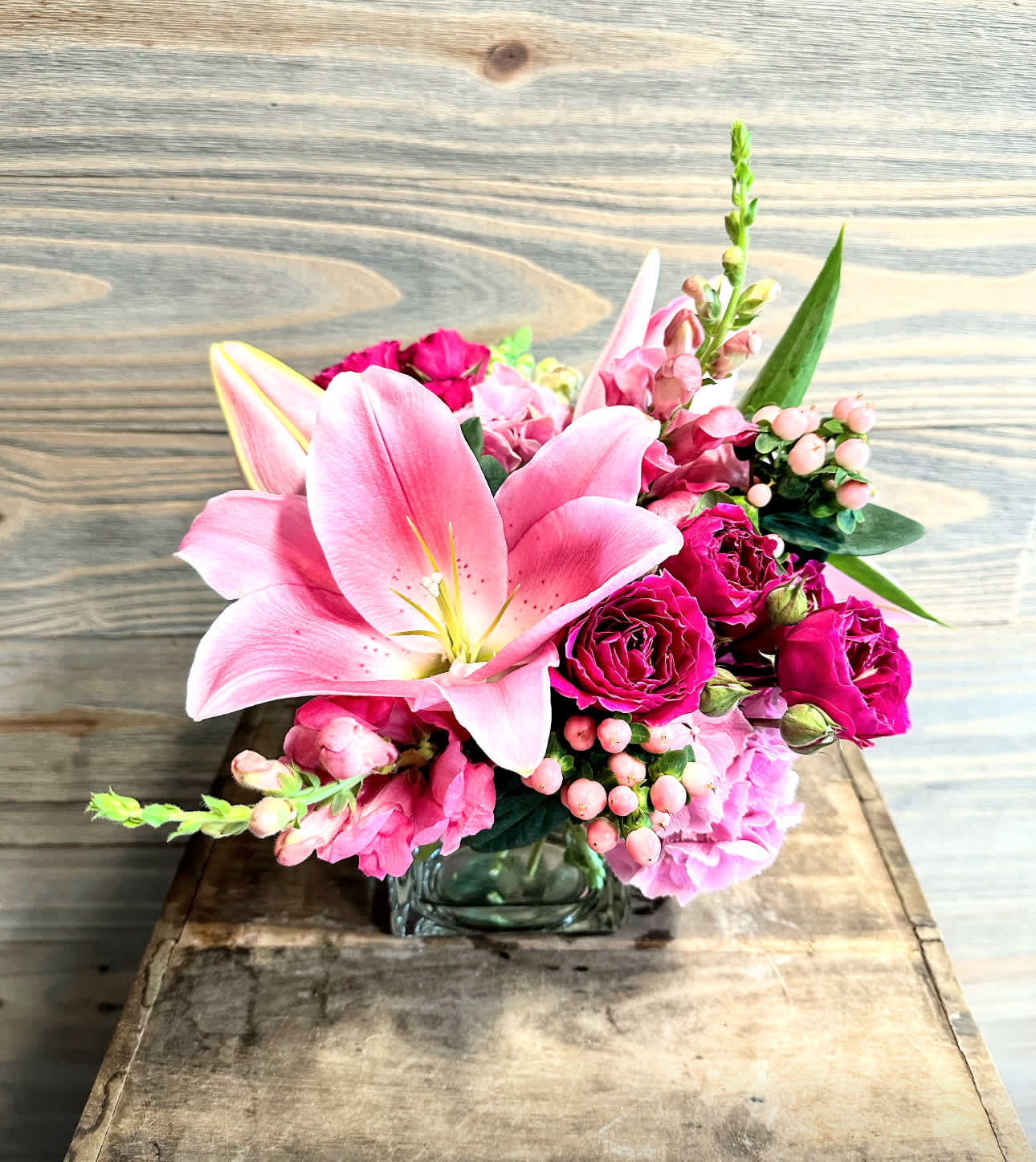 Candy Crush - A mix of pink summer blooms in a low vase.