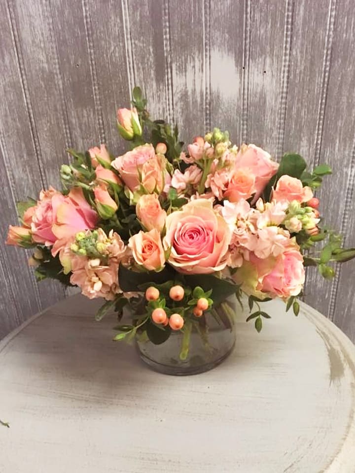 Peaches - Simple bouquet of all peach flowers with stock, hypericum, roses and spray roses.  Makes a stunning table arrangement or gift. (image subject to substitutions depending on availability; color scheme and over all feel of arrangement is similar as possible)