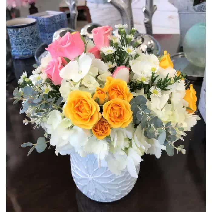Special Memories - A dainty, soft and colorful arrangement of hydrangea and tiny spray roses.