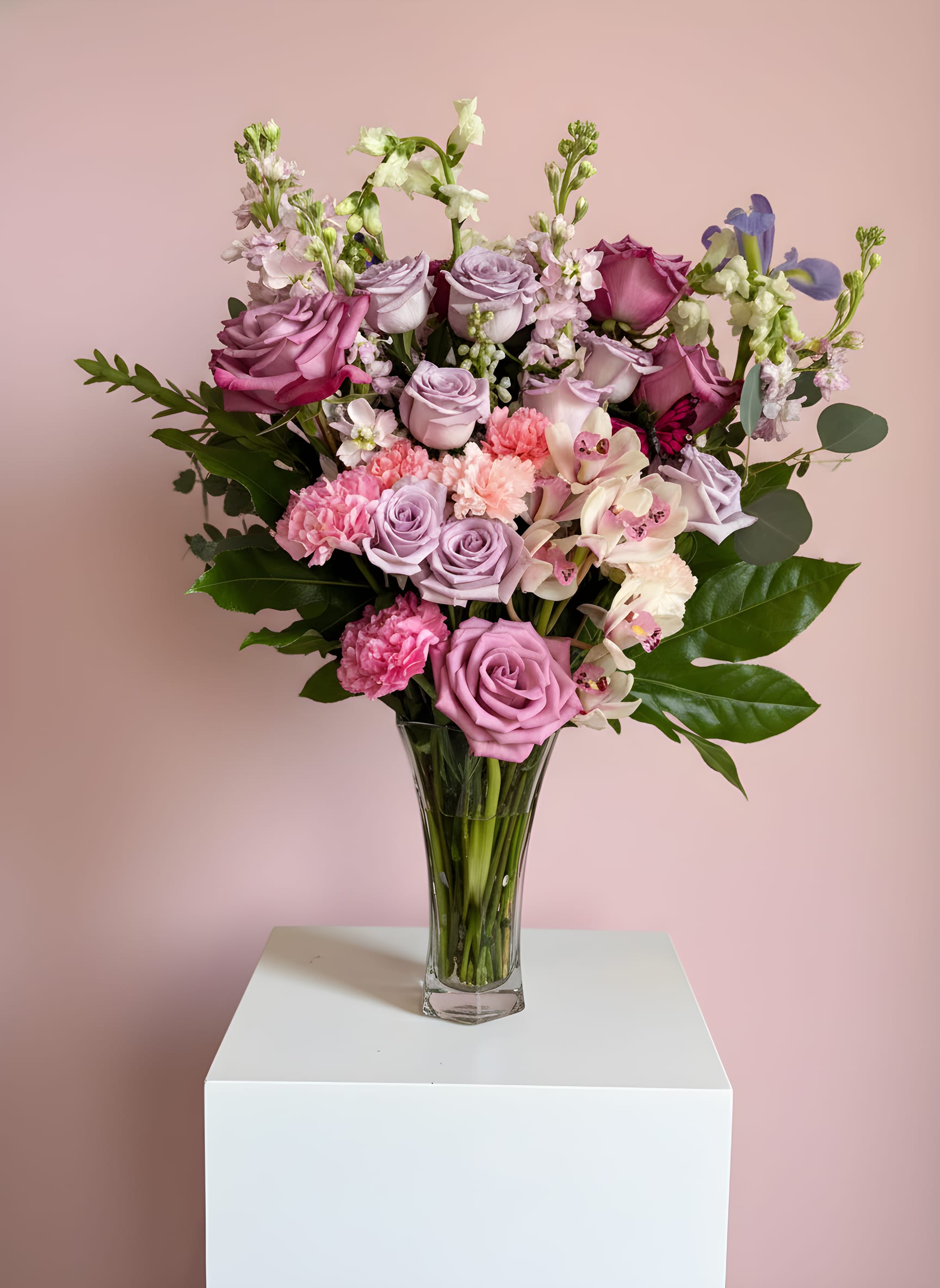 Lavender Kiss - Soft lavender and blush florals arranged in an elegant glass vase with a romantic garden feel.