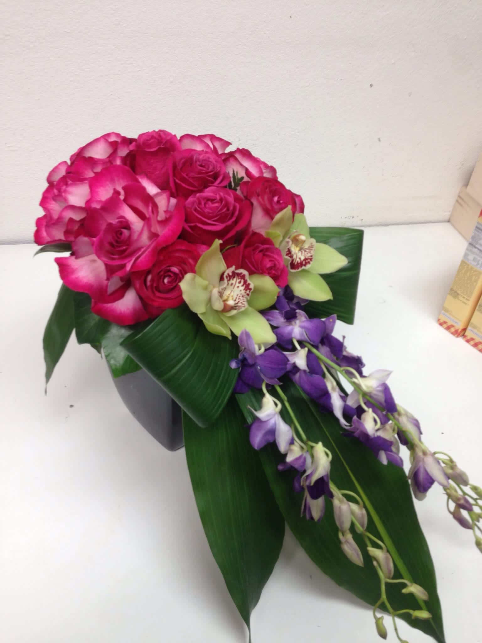 roses and orchids  - Hot pink roses purple  Orchids      Green Cymbidium     