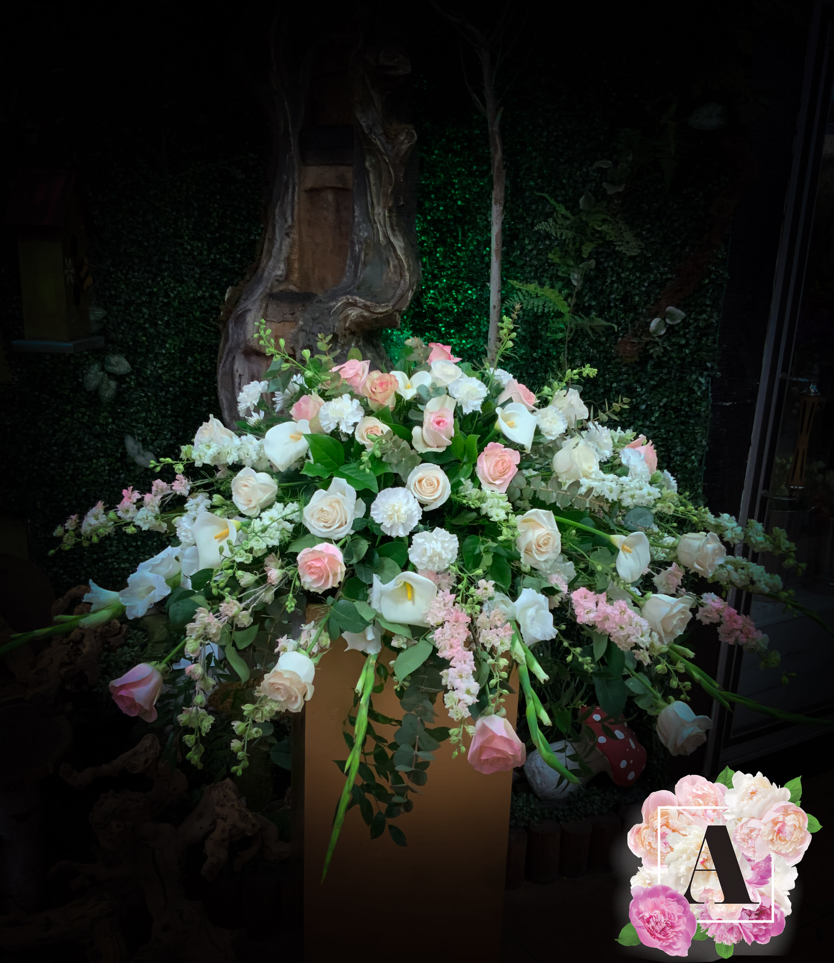 Forever Loved - Grand casket topper with seasonal mix of beautiful flowers. Please let us know of any color change preference. Will come approximately as shown. 