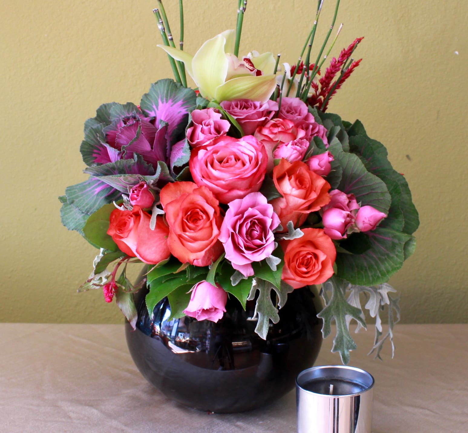 Black Elegance  - Coral long stem roses, pink spray roses and orchids in a black glass bubble bowl 