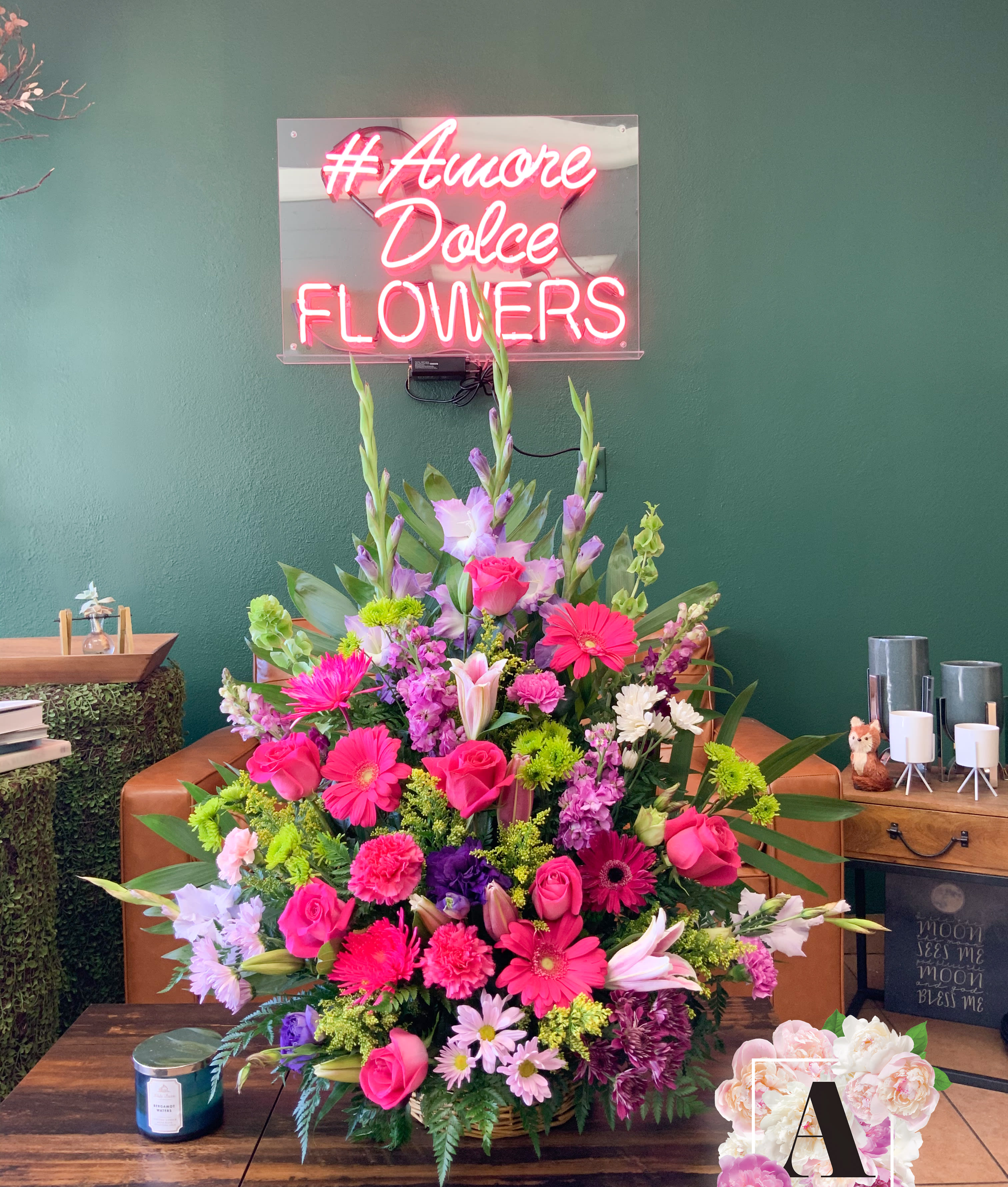 Large mixed bouquet with pink, purple, and white flowers in a basket