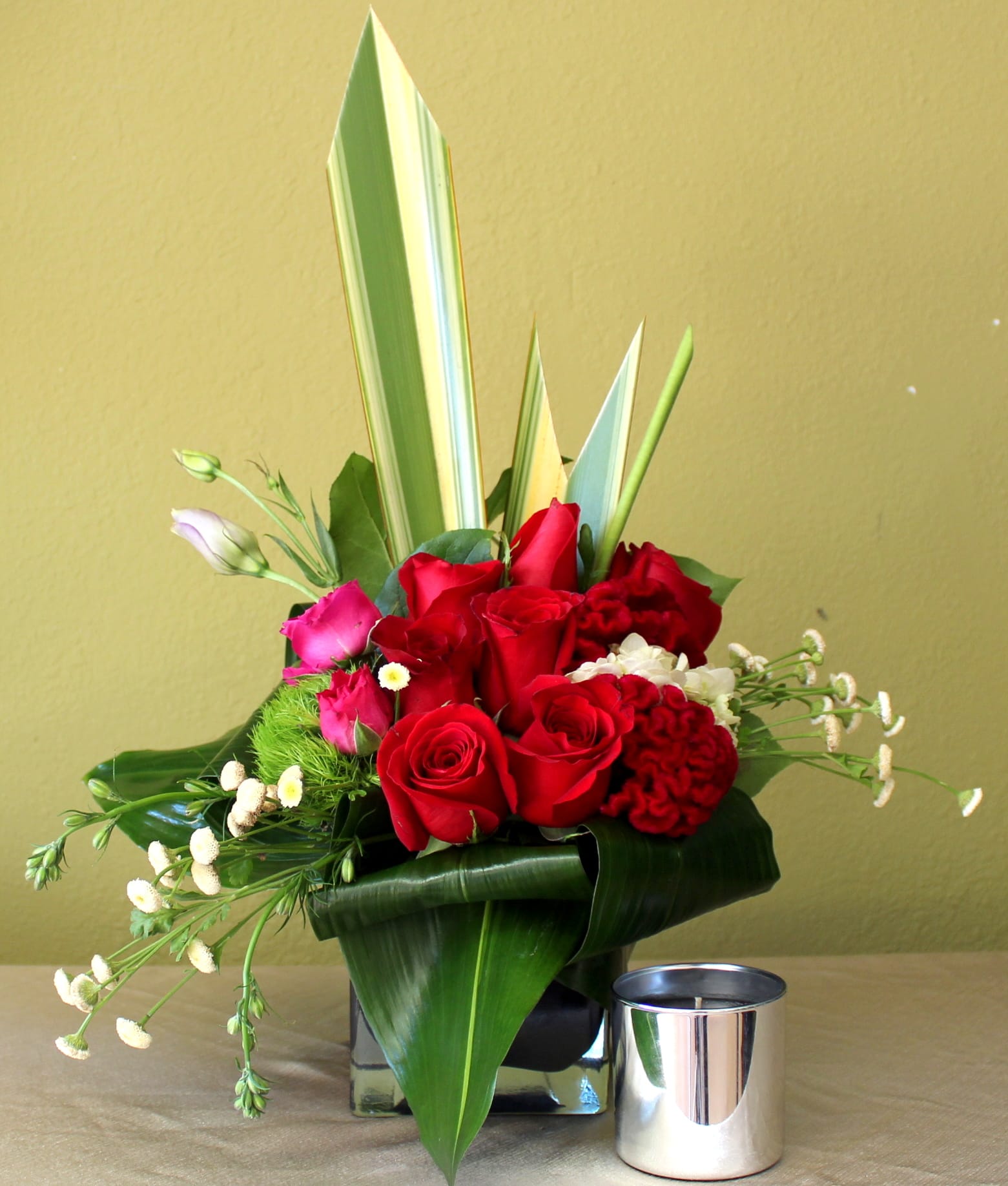 Loving You - Red roses, purple lisinthus, white hydrangeas in a clear cube vase.