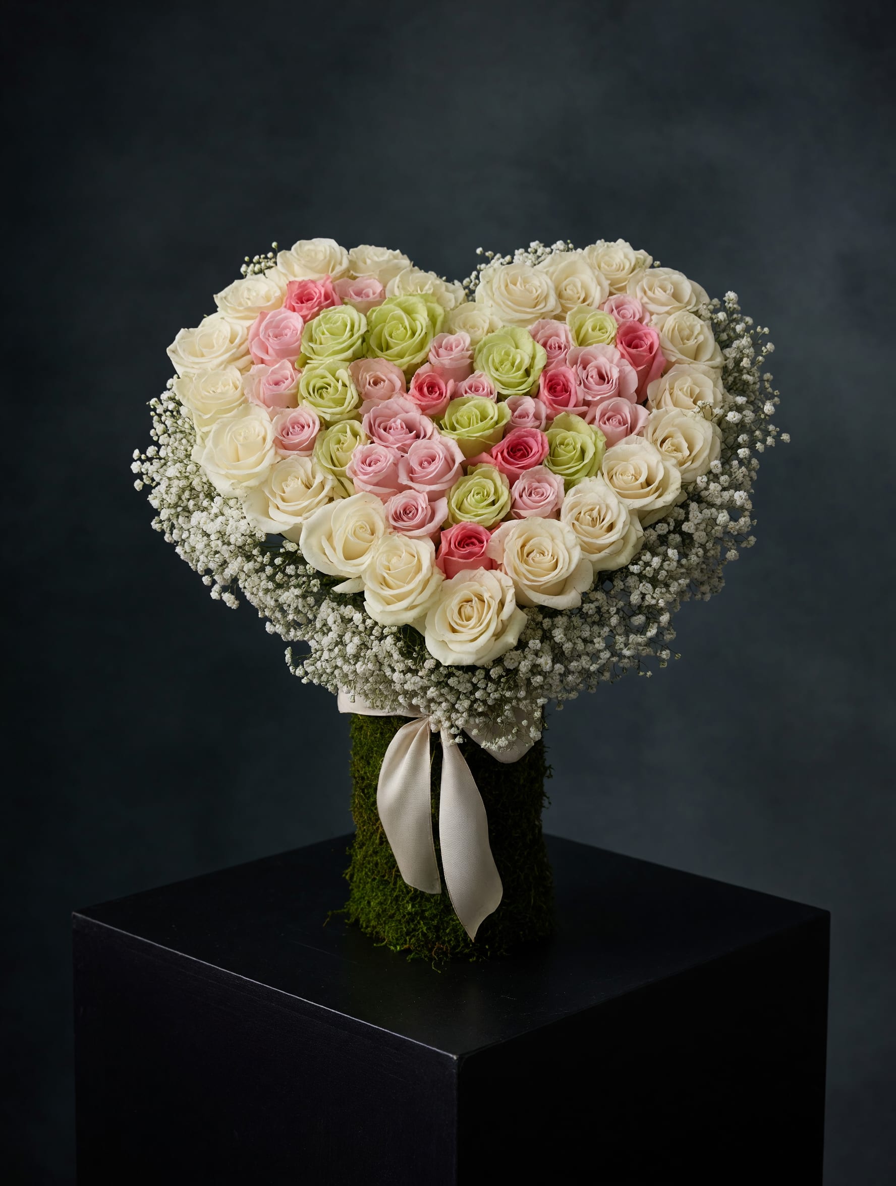Heartstrings - A handcrafted heart-shaped rose arrangement designed to celebrate love in a timeless way.