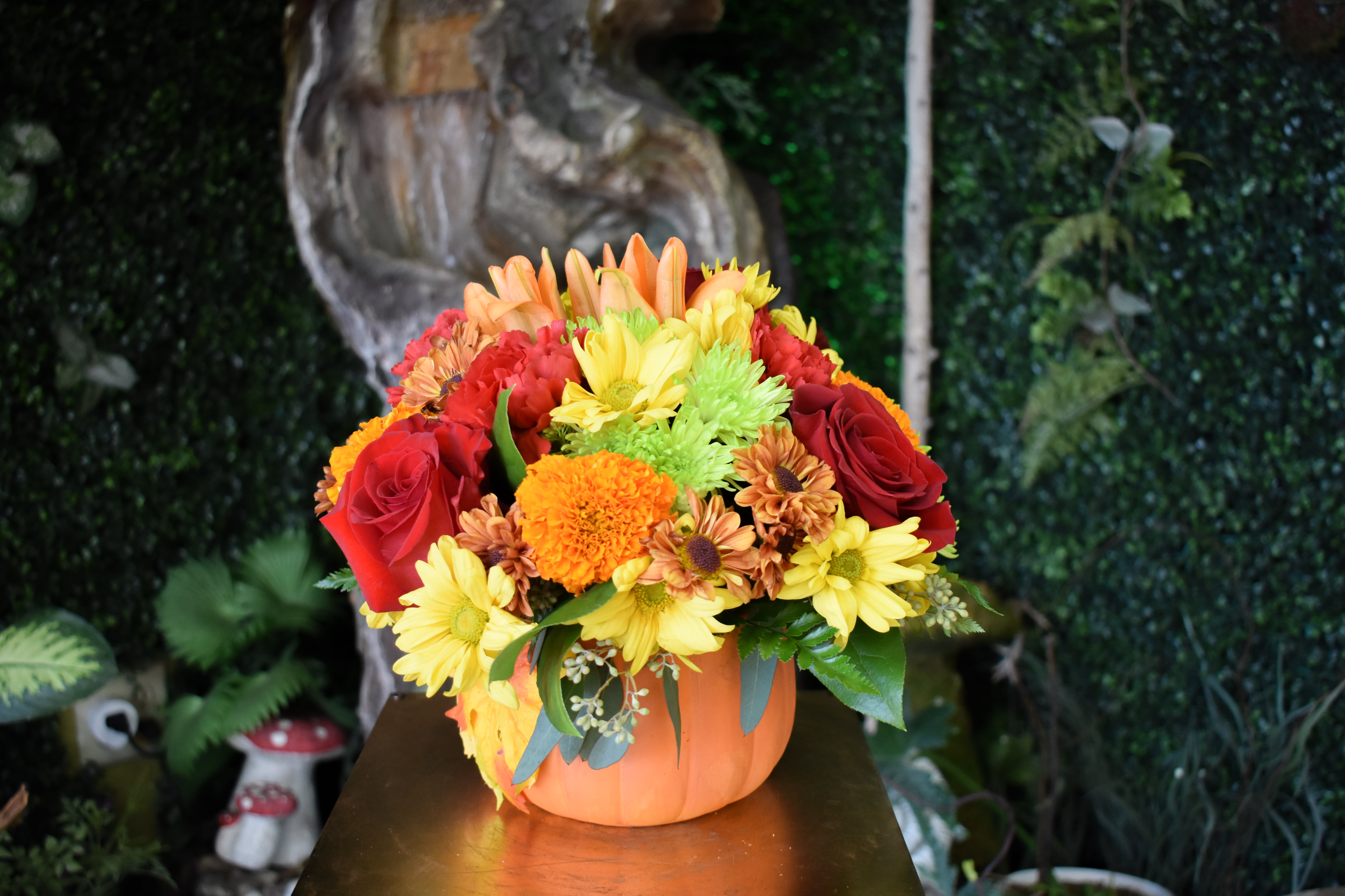 Gathering pumpkin - pumpkin ceramic fill with orange lily's, red carnations and buttons mums, red roses, coffee beans     Florist montebello Downey East la Pico rivera whittier   