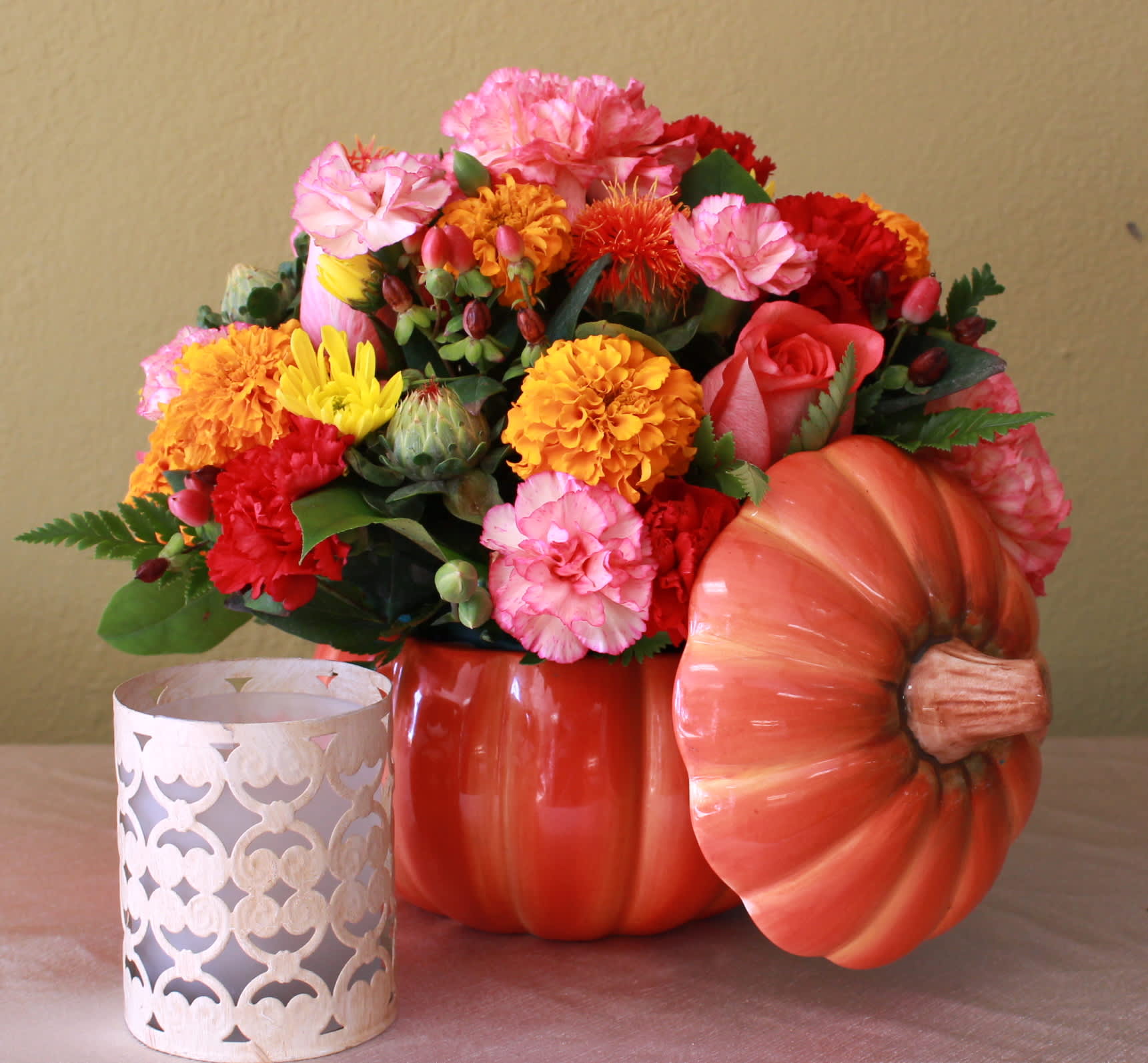 pumpkin gathering two - pumpkin candy dish fill with mini carnations, carnations, Mary gold's, coffee beans   and roses 