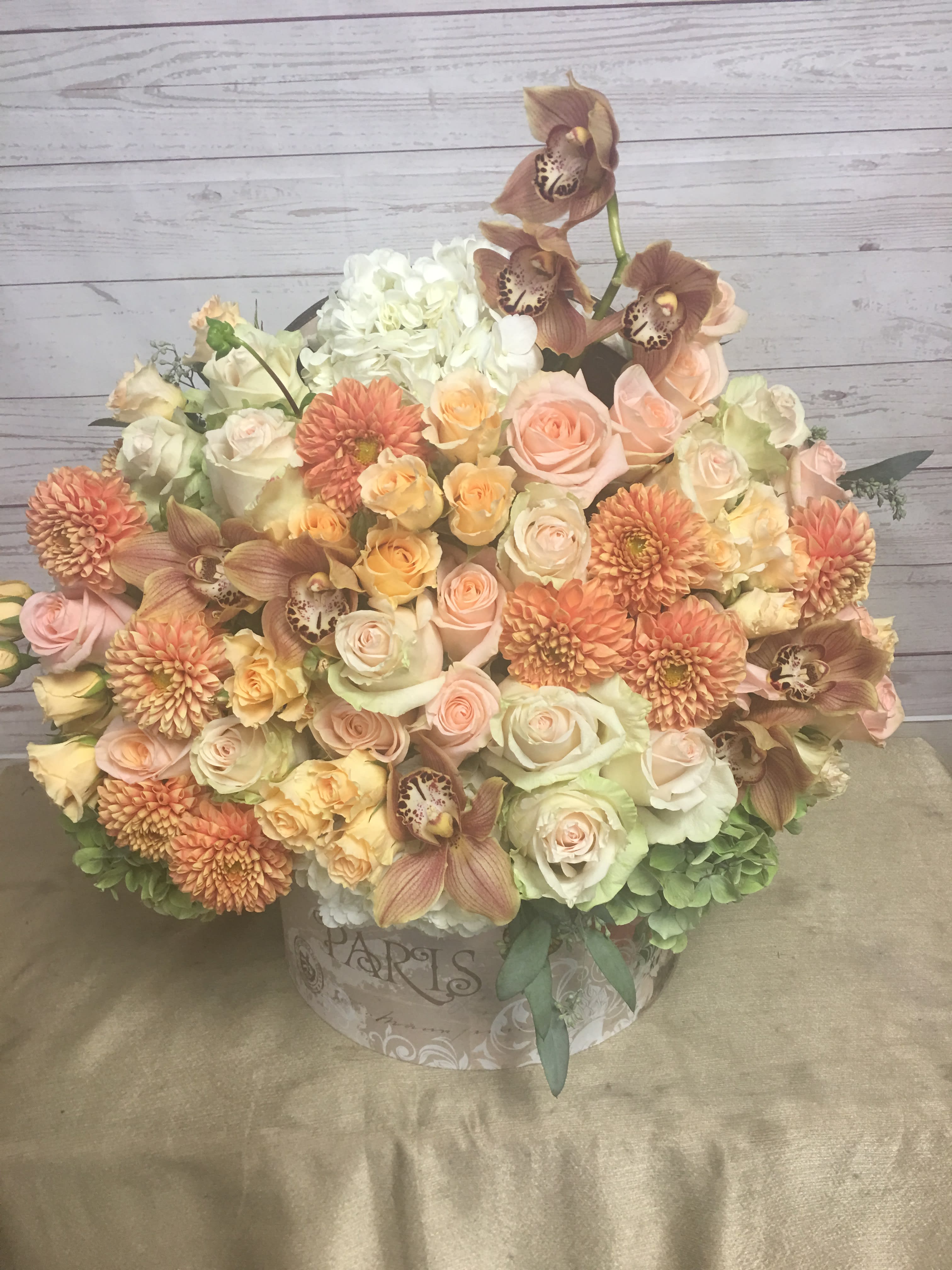 Autumn Delight - Perfect for those who love autumn colors. Beautiful and warm colors of peaches, creams, and oranges. Makes a great gift for any occasion.   The best florist in Montebello ca 90640.