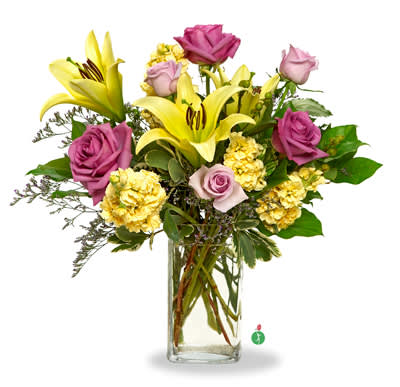 Arrangement of yellow lilies, yellow carnations, and lavender roses in a tall clear glass vase