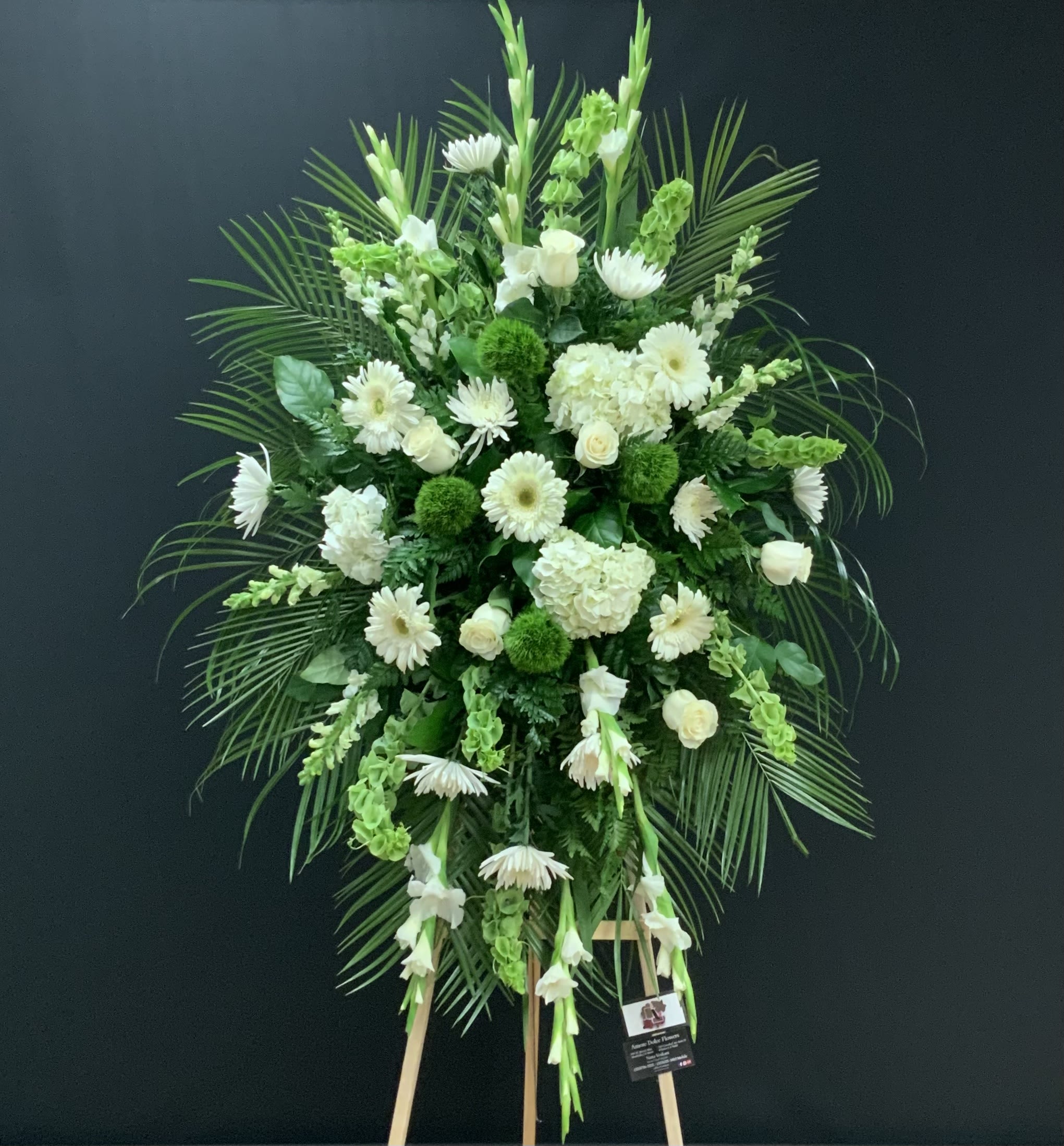 Caring Thoughts  - Flowers will come as shown. Some substitution will vary depending on availability and season. A photo will be sent prior to delivery for approval. Arrangement comes on a 6´ easel. 