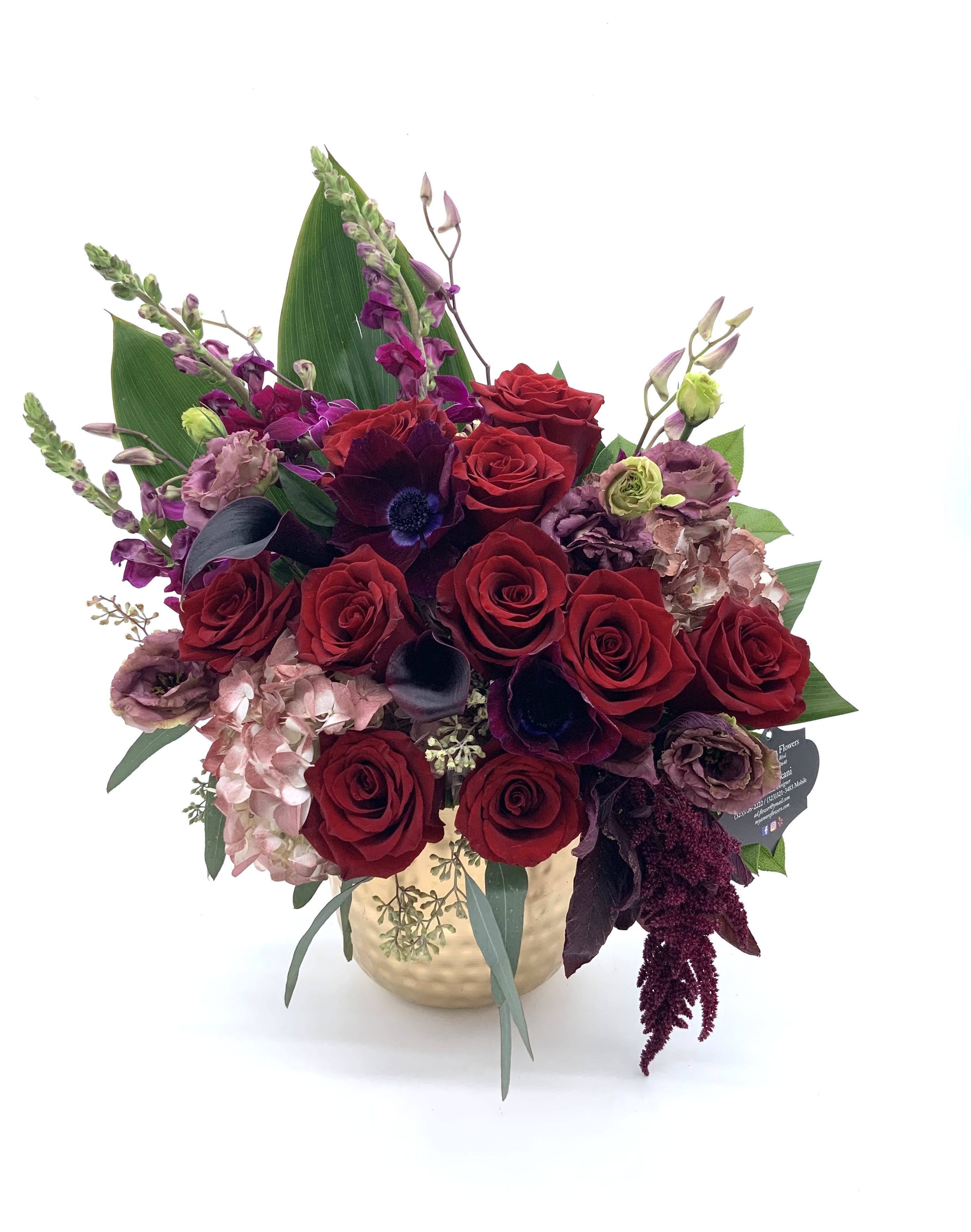 Deep Reds  - Gorgeous red Ecuadorian roses with a beautiful mix of complimenting flowers arranged in a gold metal vase. Sure to make a statement for any occasion 