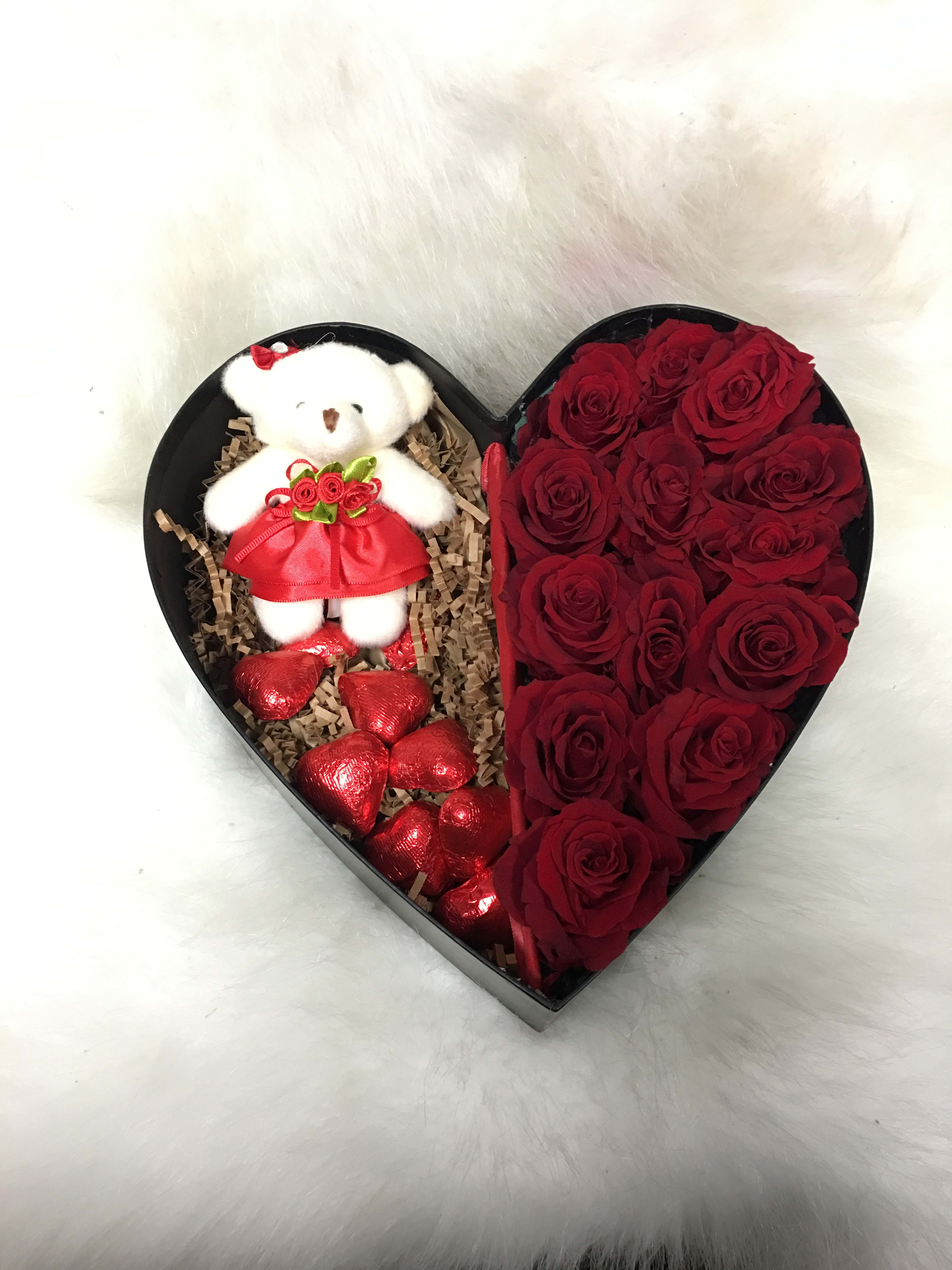 Heart Box Combo - Heart shaped box with chocolates, red roses, and a mini teddy bear. Boxes come in light pink, white, and black. Please specify color desired. 