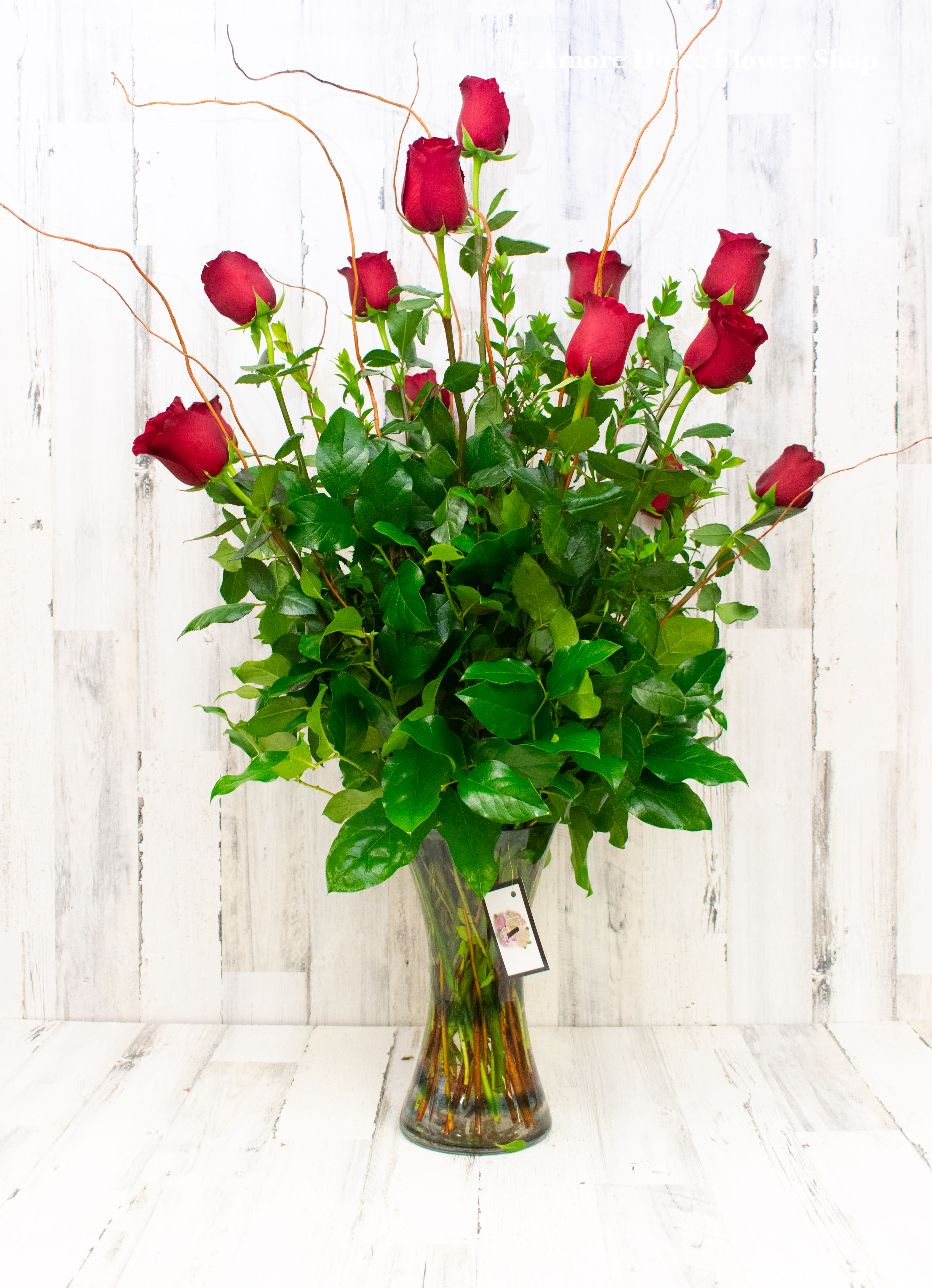  Traditional Classic Dozen Roses  - One dozen long stem Premium roses with fresh greens in a tall glass cylinder vase.             Flower delivery montebello ,Whittier,Pasadena,Downey,Pico Rivera,la habra,downtown ,los angles 