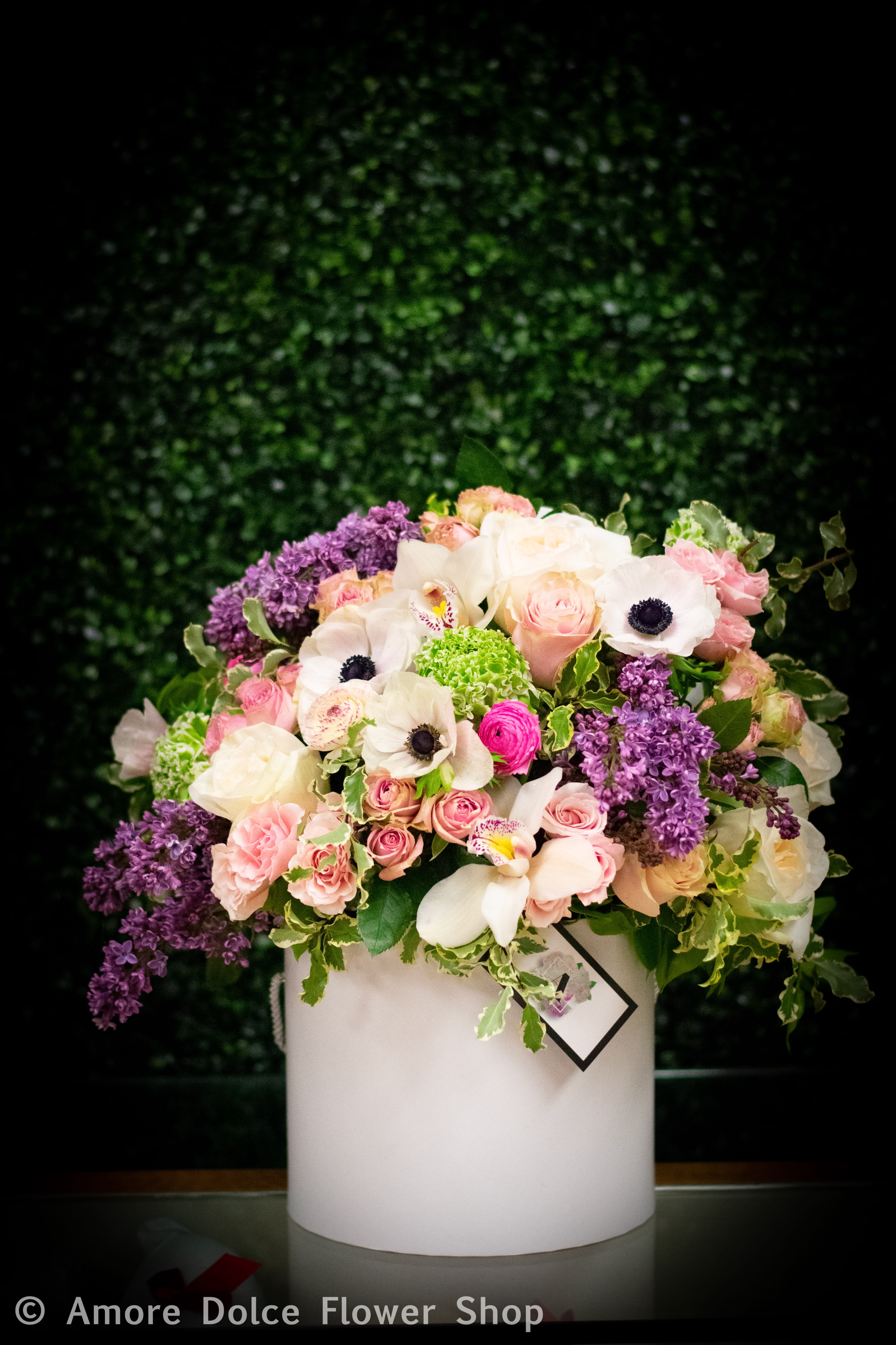 white hat box  - high end mixed flowers in a hat box 