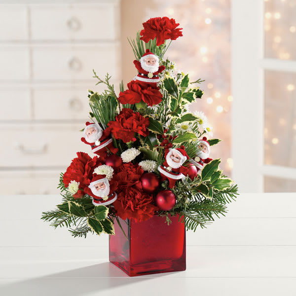 Tabletop Santa Tree - Adorable Santa Claus ornaments and holiday baubles decorate this tabletop tree. Will bring the holiday spirit into any home or office.