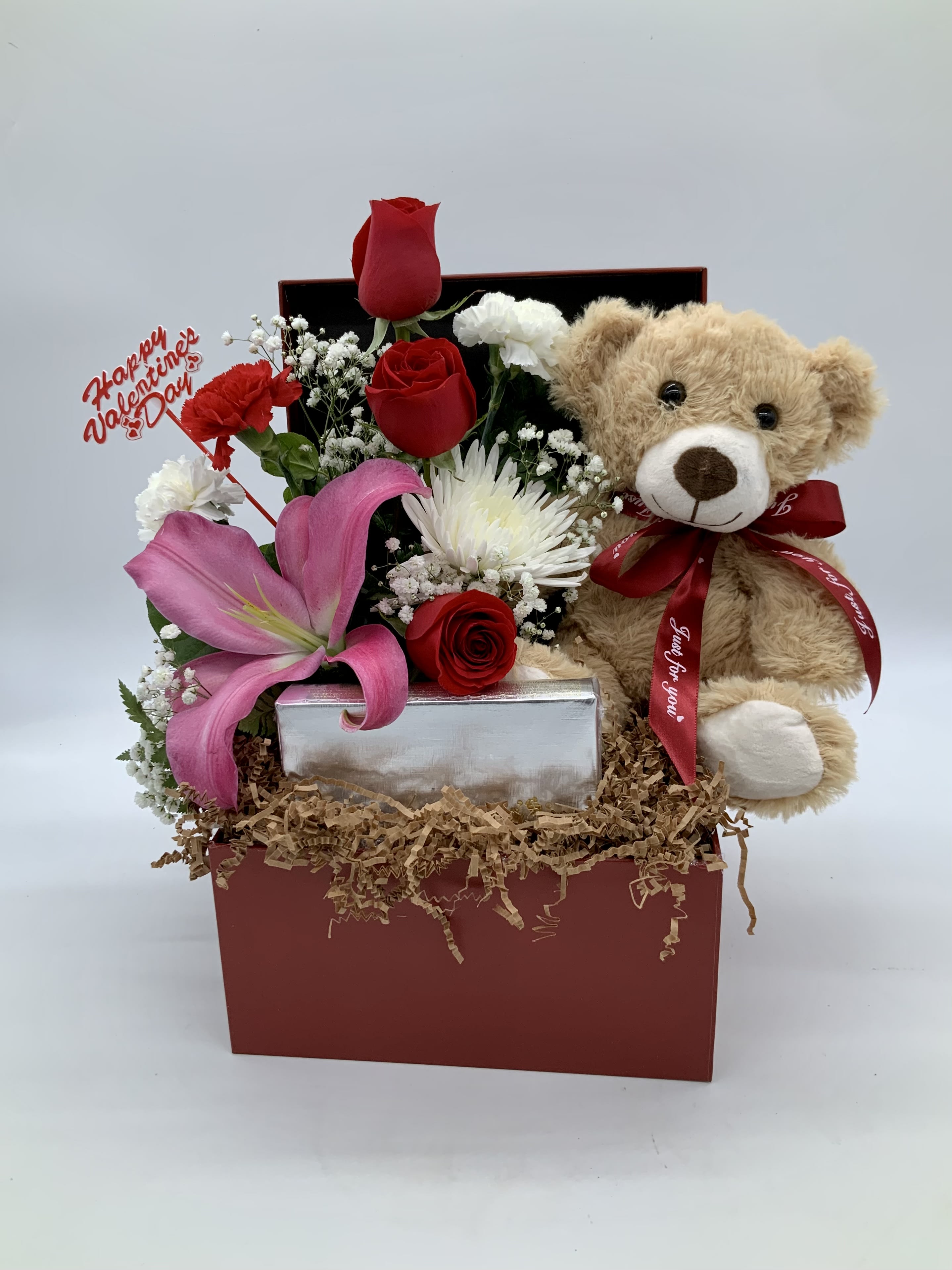Gift box with red roses, pink lily, and teddy bear