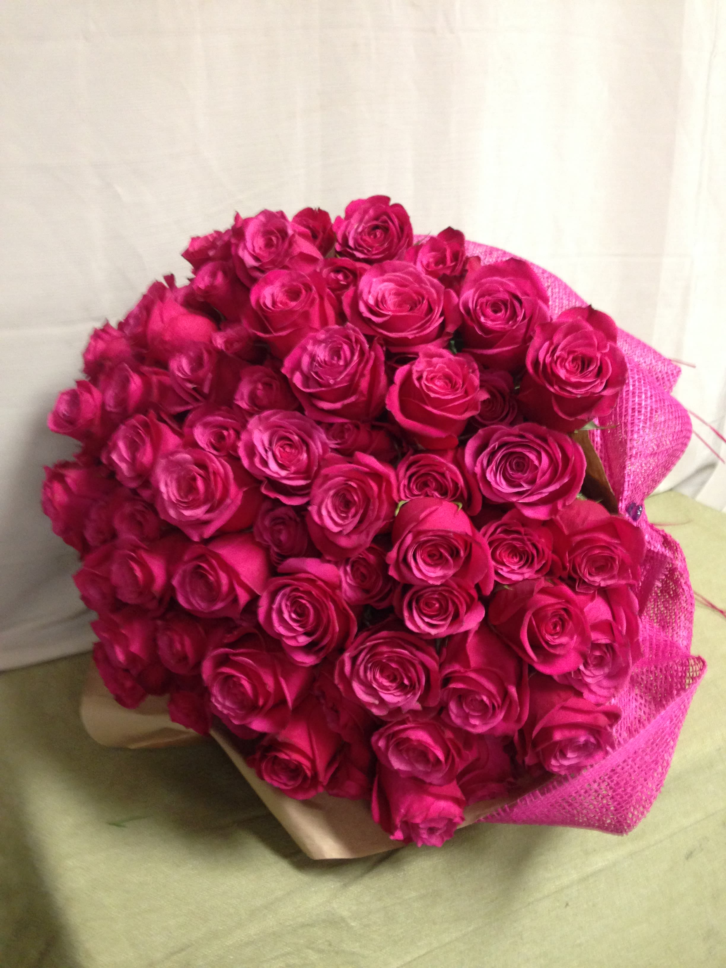 100 Longstem Roses (Presentation Style) - Choose your color - 100 Longstem Roses wrapped presentation style (no vase). Please indicate your color preference in the special instructions at checkout.