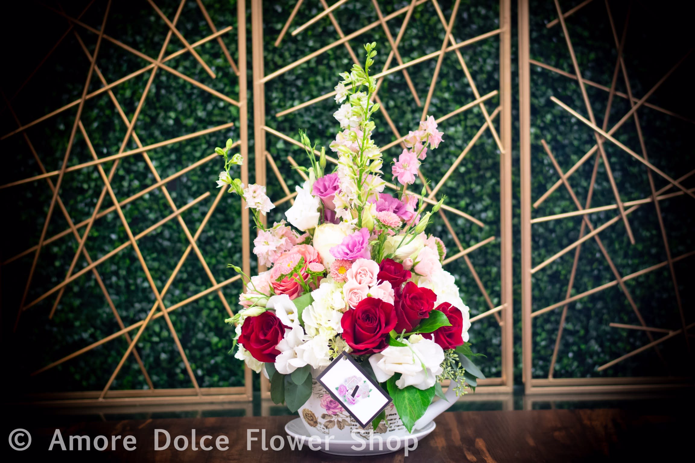 Tea cup  Delight  - A charming and whimsical floral arrangement suitable for any occasion. 