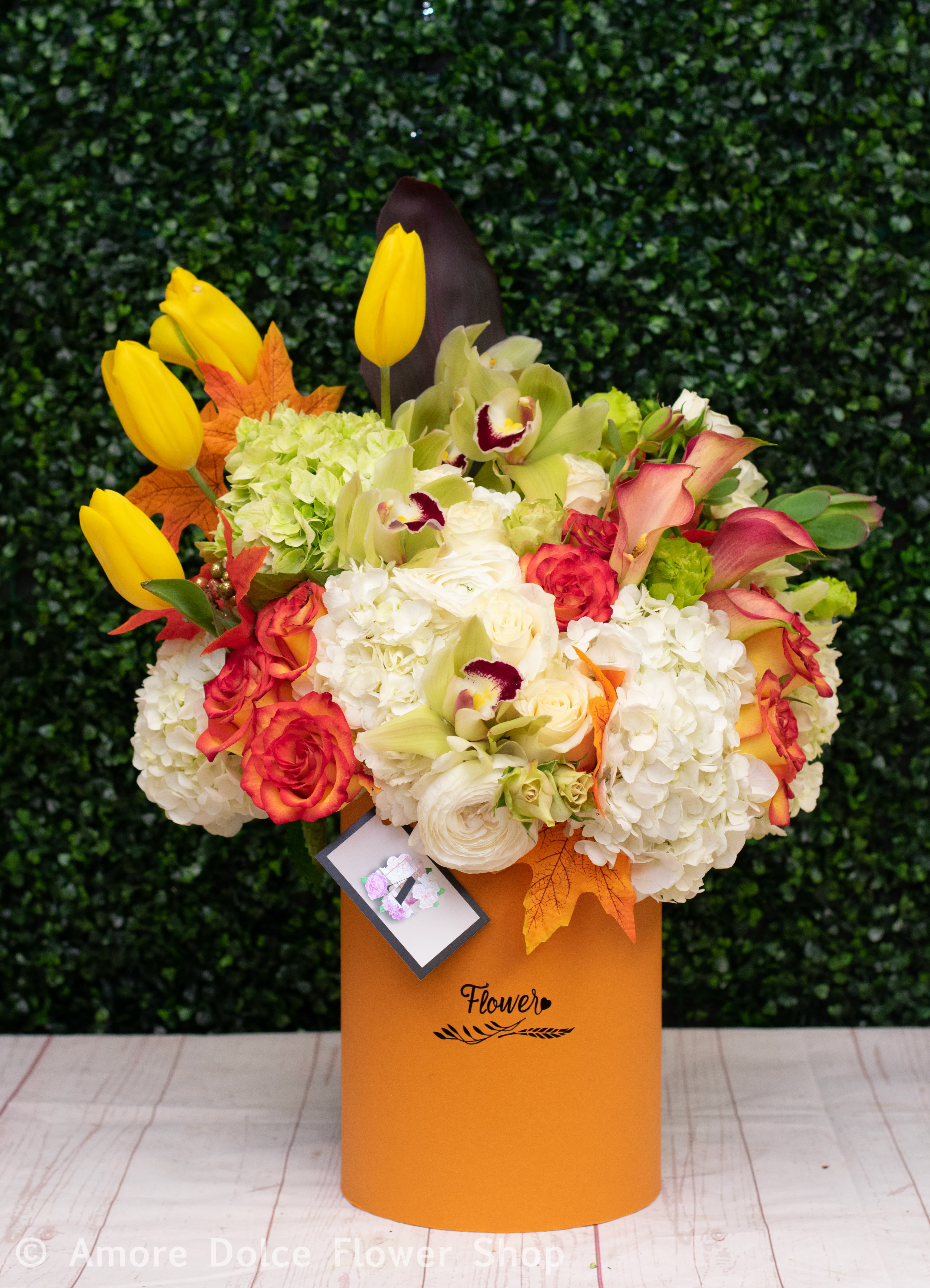  Autumn Lovers Hat Box -  Roses orchids and tulips in autumn colors in our beautiful burnt orange hat box. 