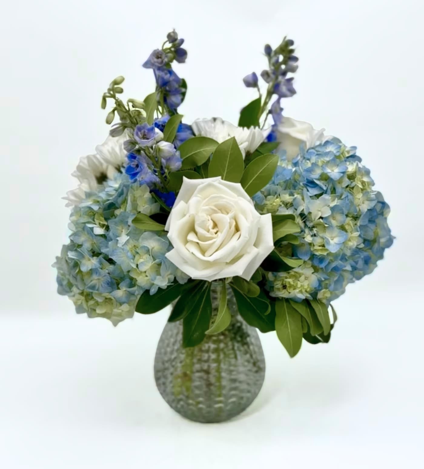 Blue Skies Over Charleston - Send a bit of the beautiful blue skies to convey your feelings.  This uplifting arrangement comes in a beautiful mix of blue and white.  The vase may vary but the arrangement will be similar to photo.