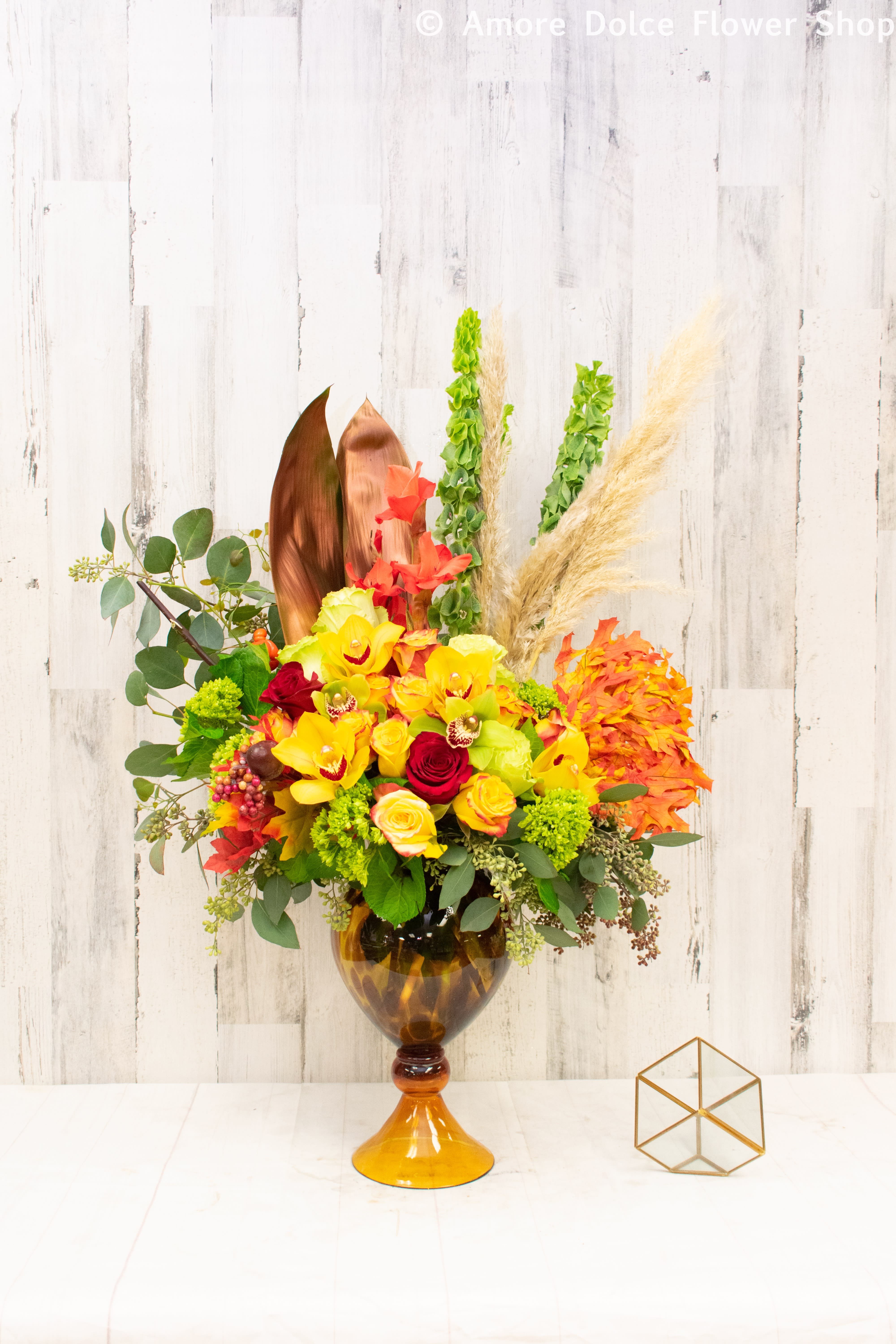 Fall in Love - Fall in love with this grand and elegant display of autumn flowers expertly arranged by our skilled florists in a tall hand blown glass vase. Includes roses, orchids, hydrangeas, and more. Perfect for any occasion.          Flower delivery montebello ,Whittier,Pasadena,Downey,Pico Rivera,la habra,downtown ,los angles 