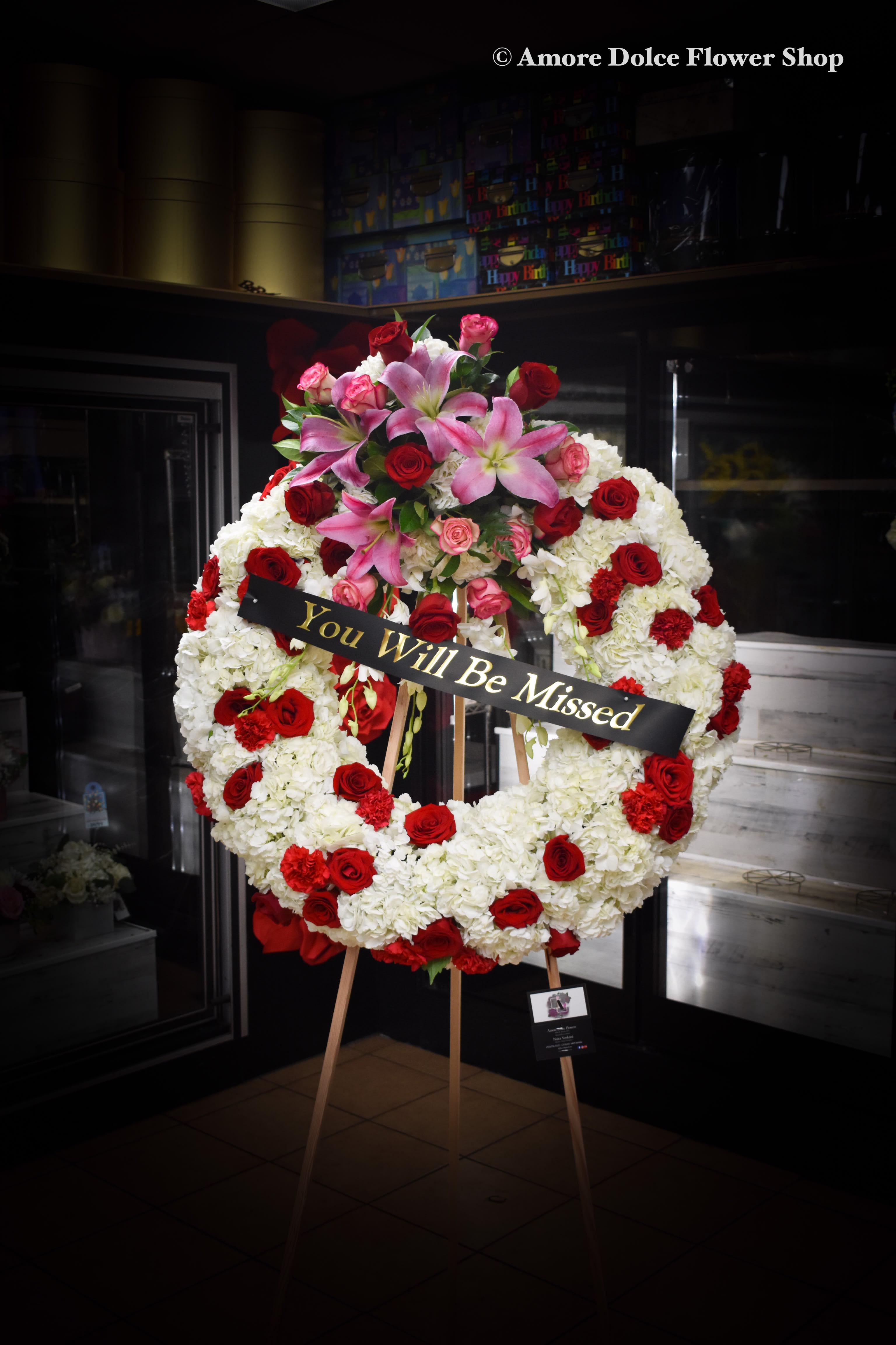 Sympathy wreath red and white flowers  - Wreath will be made similar to photo this size of the wreath is 28 inches if you would like to add a ribbon there is an additional cost