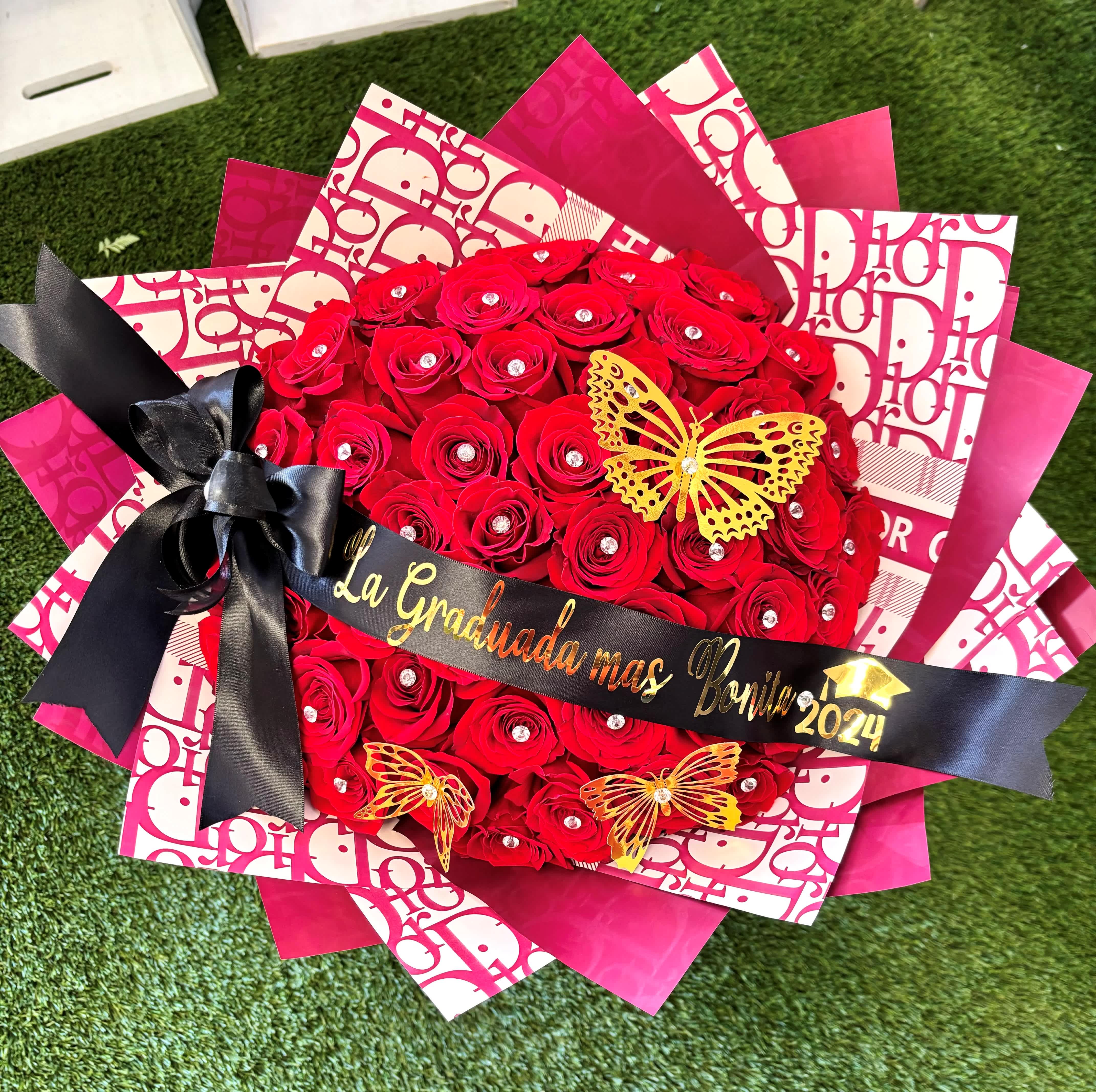 Red rose bouquet with black ribbon and graduation message