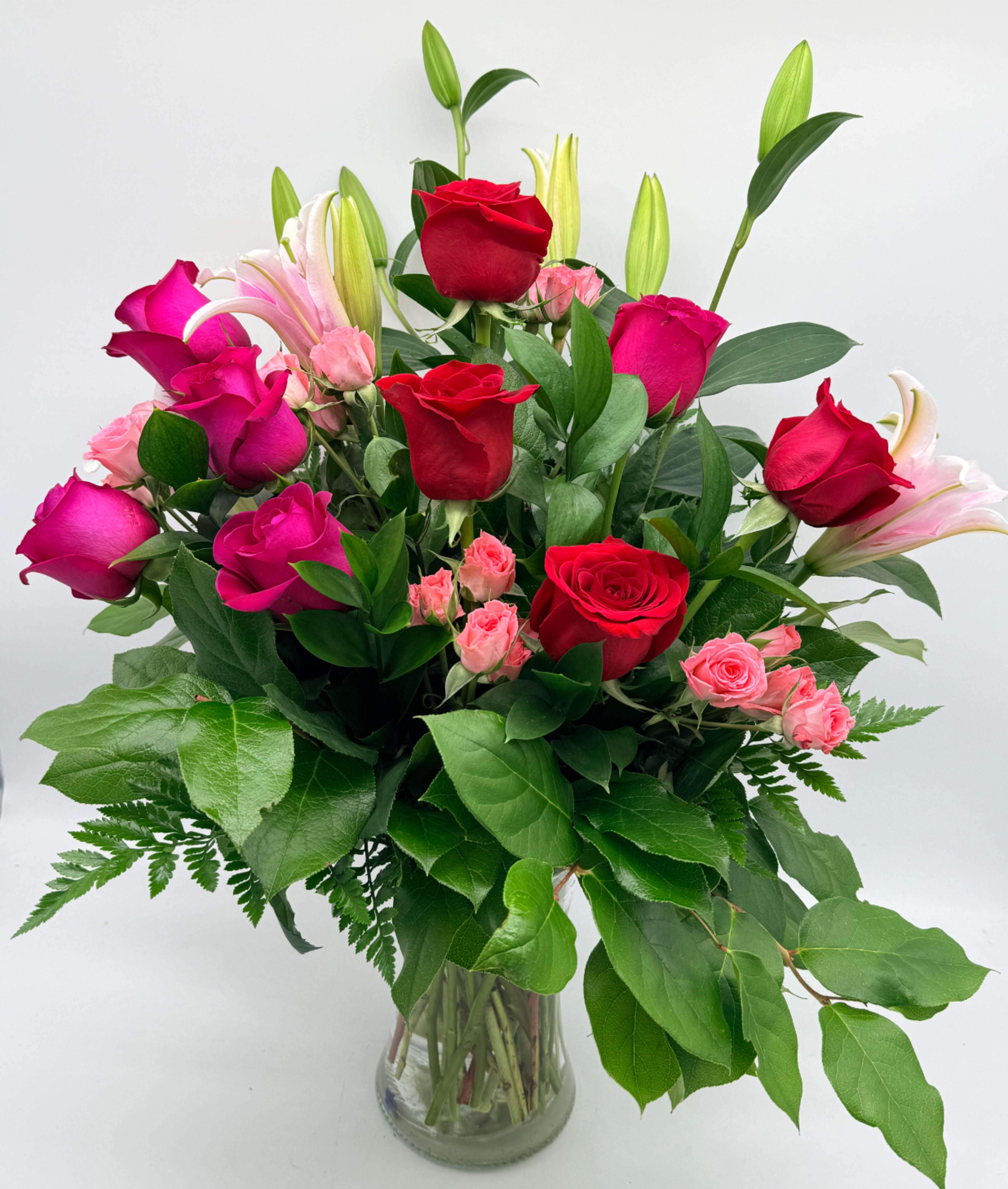 All My Love - A dreamy mix of passionate reds and sweet pink florals designed to express deep love and devotion. Arranged in a clear glass vase with lush greenery, this bouquet is perfect for moments that deserve more than just words. -Flower varieties and shades may vary.-