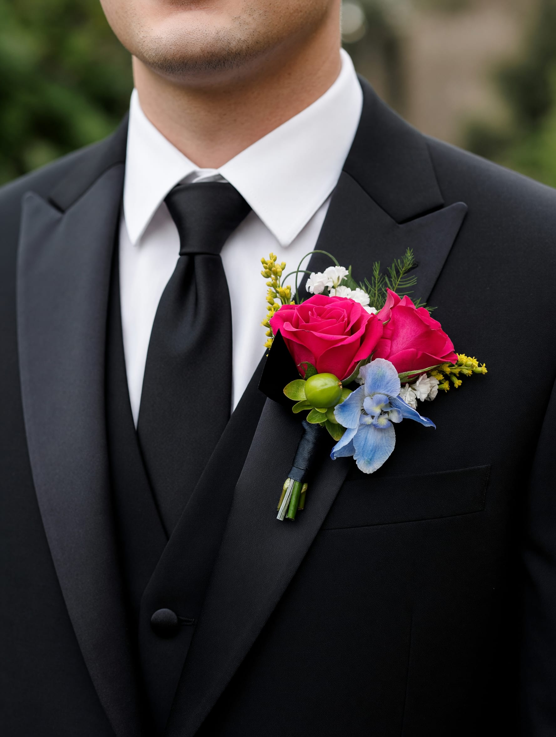 Boutonniere - Color choice option - Our Colorful Pop Corsage features a vibrant mix of colors that instantly catch the eye, adding the perfect fun pop to your prom look! Color requests are welcome but not guaranteed.  Select the deluxe option to order a bout. &amp; corsage set!