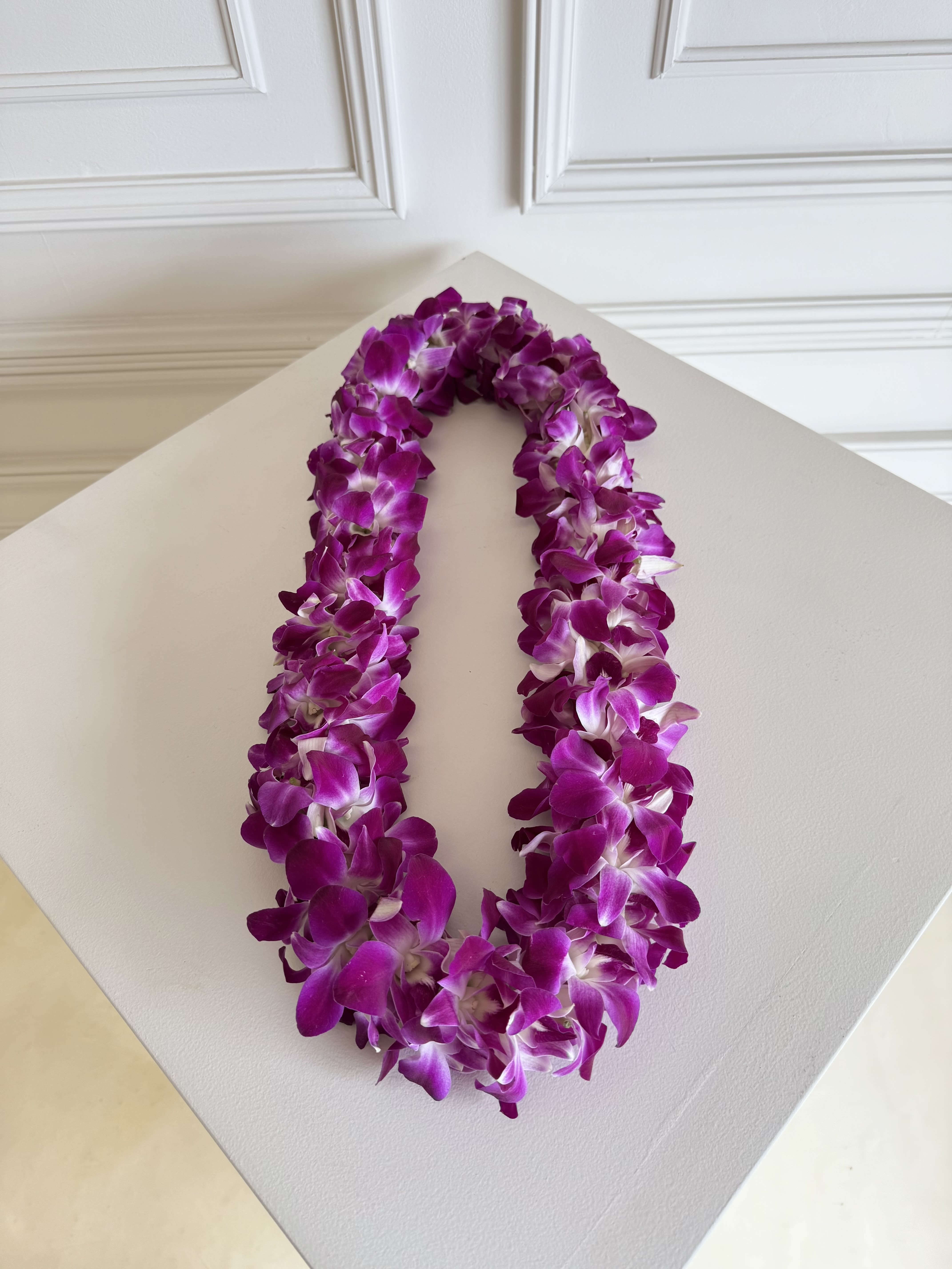 Orchid lei (Purple)  - Fresh Orchid Lei for Graduation   Celebrate your grad in style with our beautiful, fresh orchid leis — perfect for making their big day extra special! 