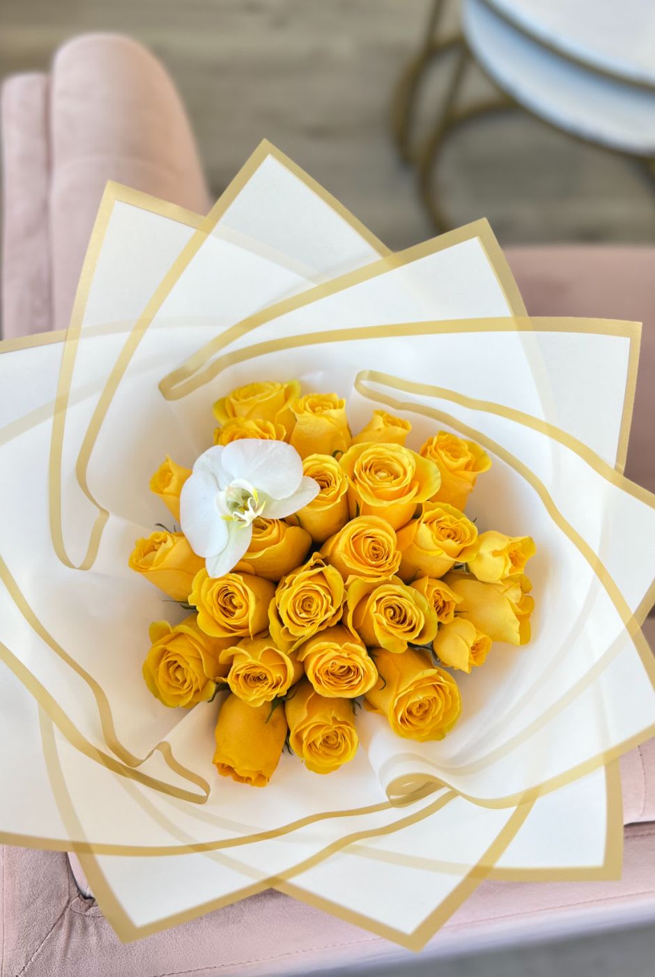 24 -Yellow Rose Ramo buchon - 24 ecuadorian yellow roses in white wrapping paper. (Orchid may vary/be exchanged for a bow)