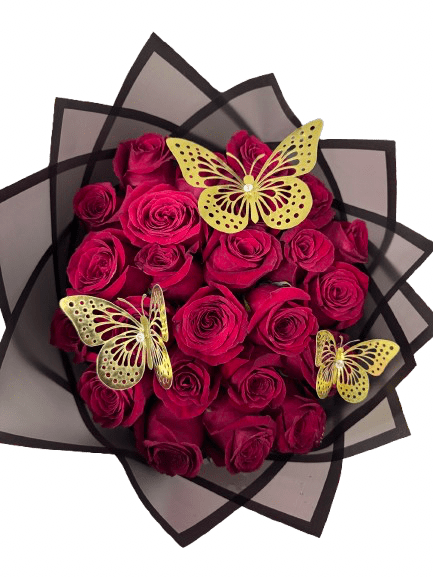 Round bouquet of deep red roses wrapped in black paper with three gold butterfly decorations.