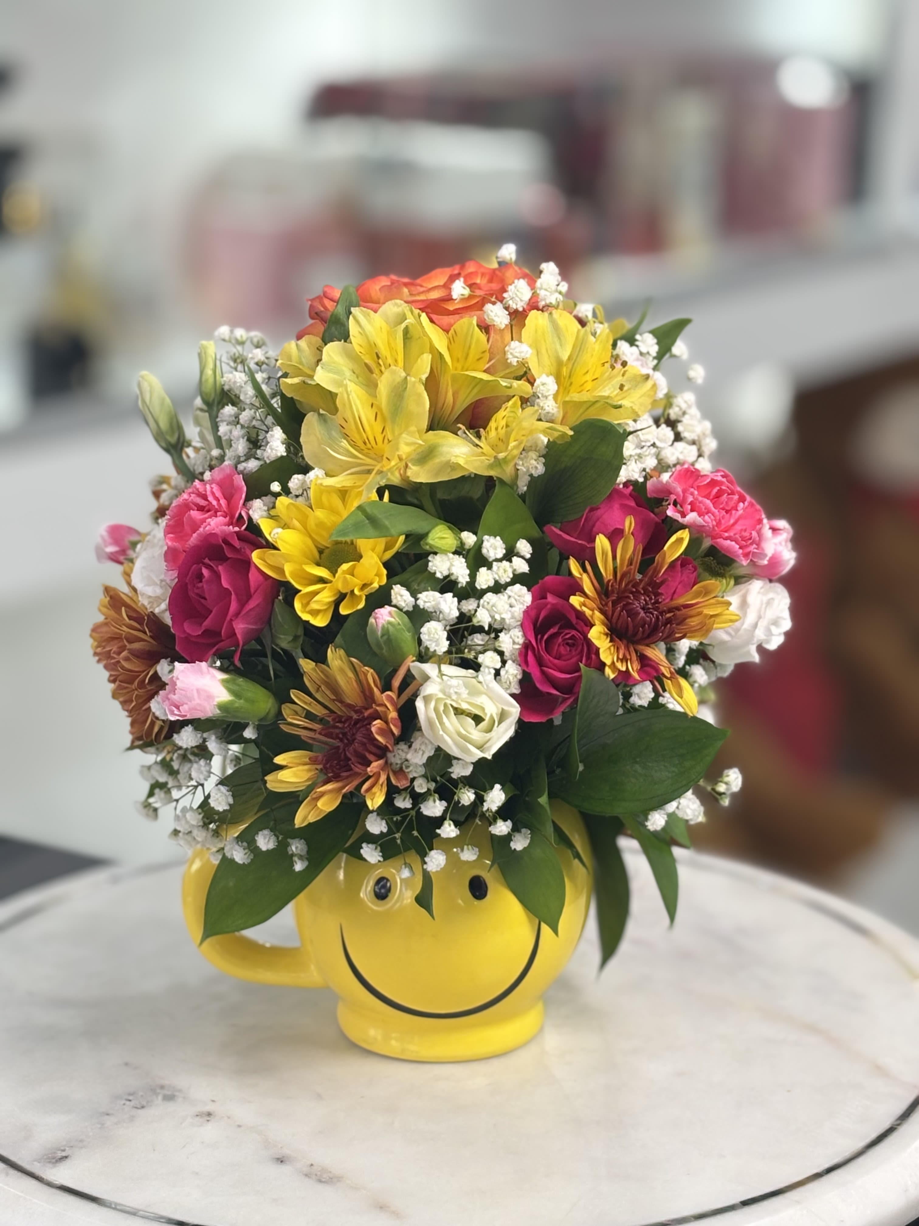 Smiling Mug - Mix of flowers in a mug.