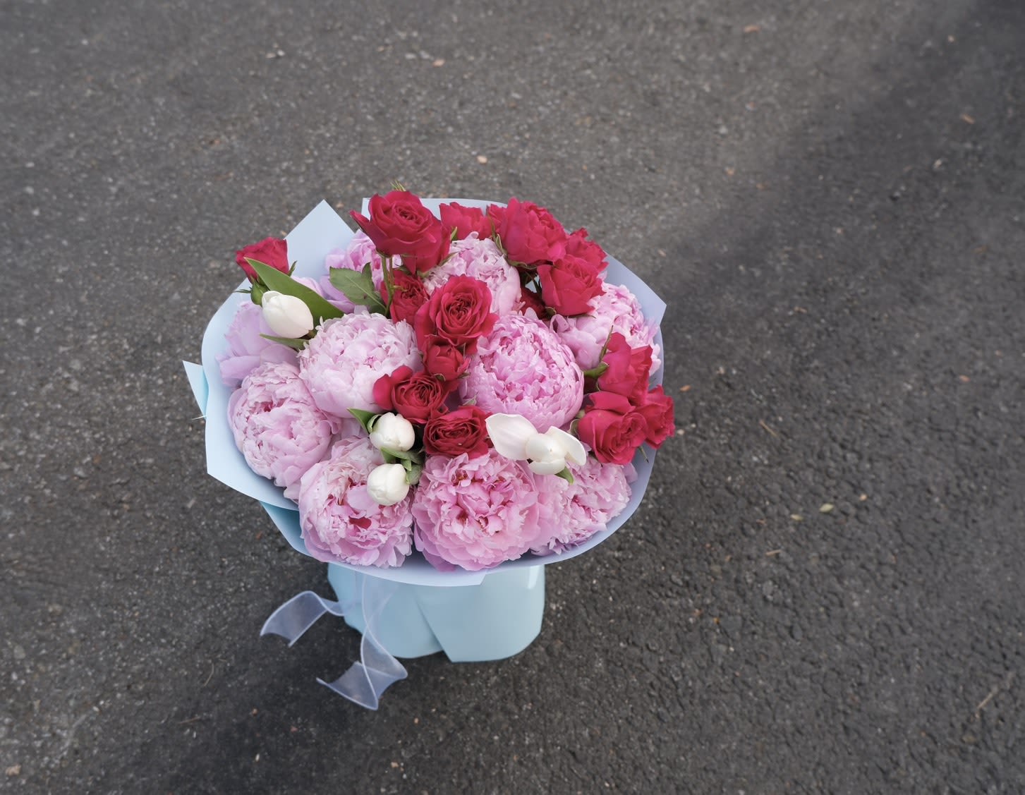 Blushing Peony Luxe - A true showstopper! Our "Peony Cloud Kiss" features lush pink peonies and soft roses in a dreamy, layered cloud wrap. It’s the ultimate romantic gesture—voluminous, sweet, and absolutely breathtaking for any special celebration.