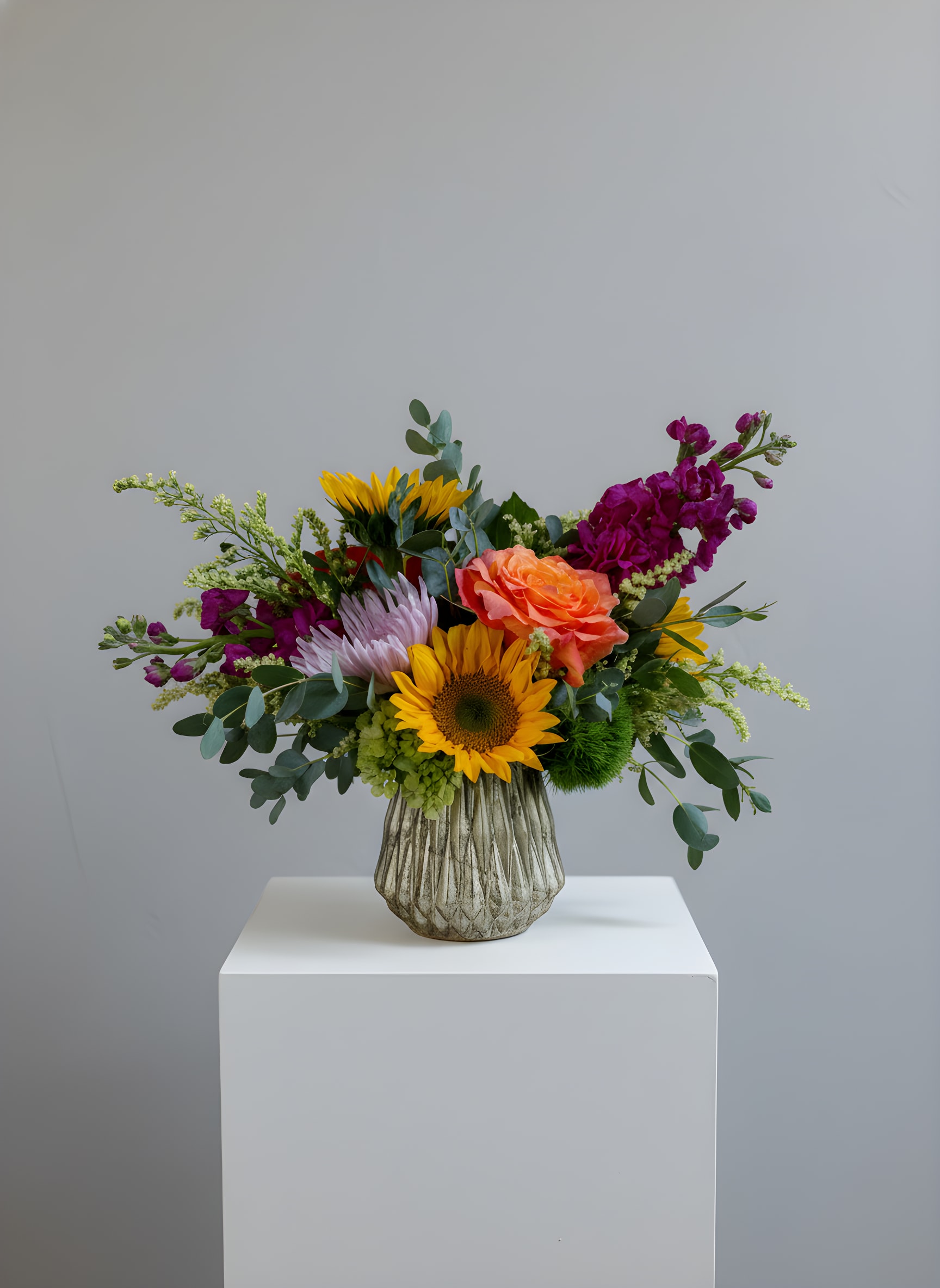 Sunny Day  - *If you order this arrangement, the vase will be the same one pictured here. *Will include Sunflower  Because flowers follow the rhythm of the seasons, their availability often changes often. Your arrangement may vary slightly from the photo, and some filler and accent varieties may differ. We design with the freshest blooms available, making substitutions when needed—while always preserving the overall mood and shape. Always fresh, artful, and beautifully composed.  The arrangement delivered will be inspired by this photo.  For specific flower or color requests, please contact us before ordering.