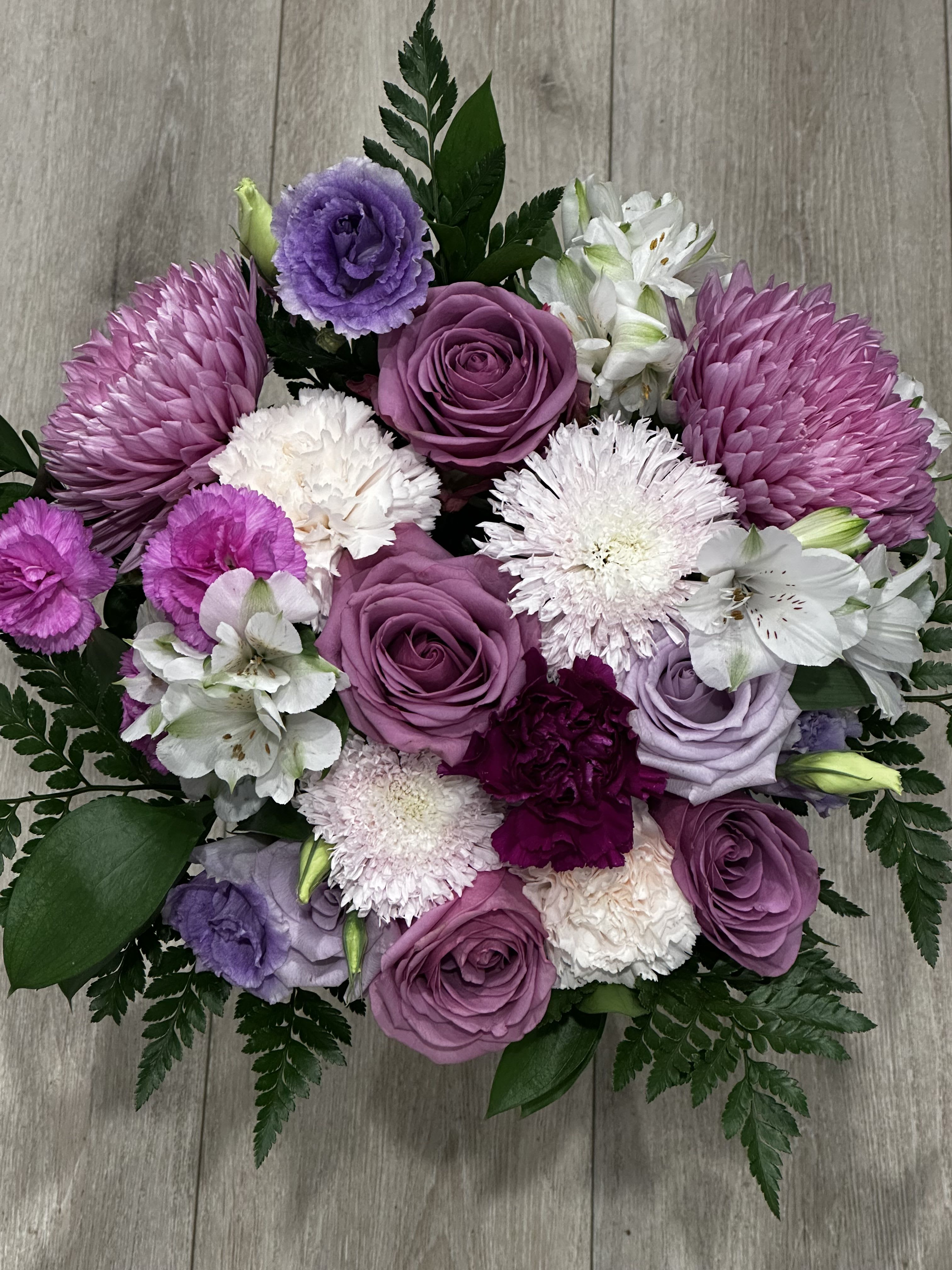 Graduation Bouquet - Mix bouquet with graduation cap wrapping and a bow   Flower colors can be customized, add request in special instructions.