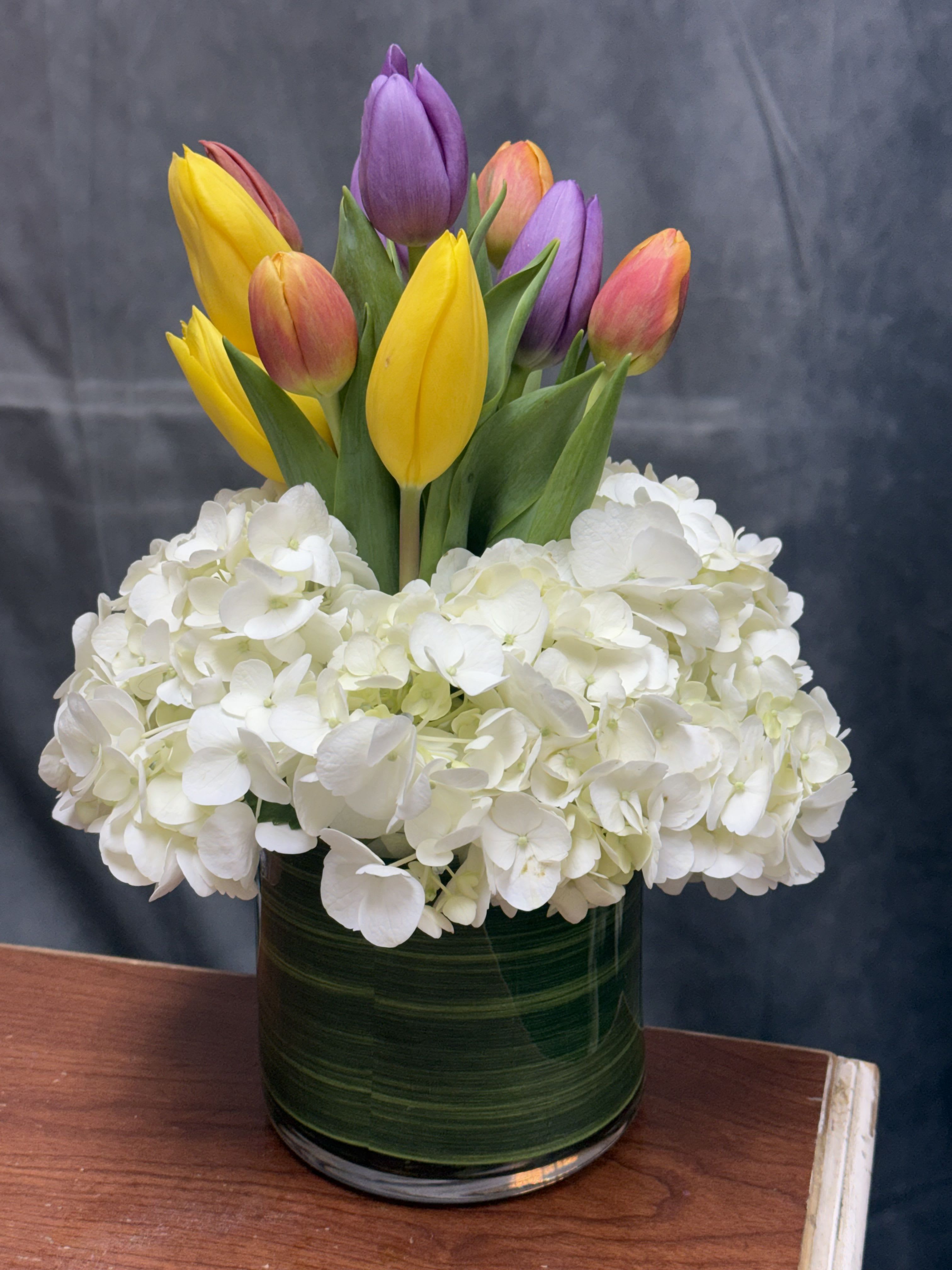 Tulips Kisses  - Say hello to Tulip Kisses  a delicate blend of tulips and hydrangeas, designed to bring a soft touch of love and elegance to any space. Perfect for sharing sweet moments and blooming smiles