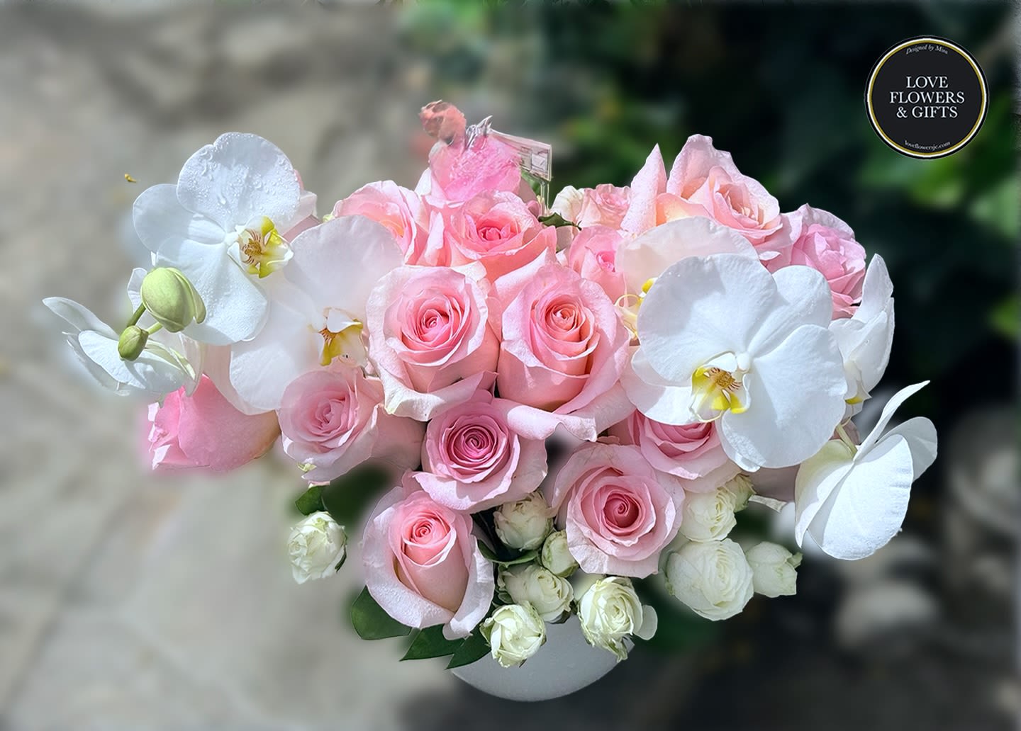 Pure Orchids and Roses - Clean and elegant design with soft pink roses and pure white orchids in a ceramic vase. 