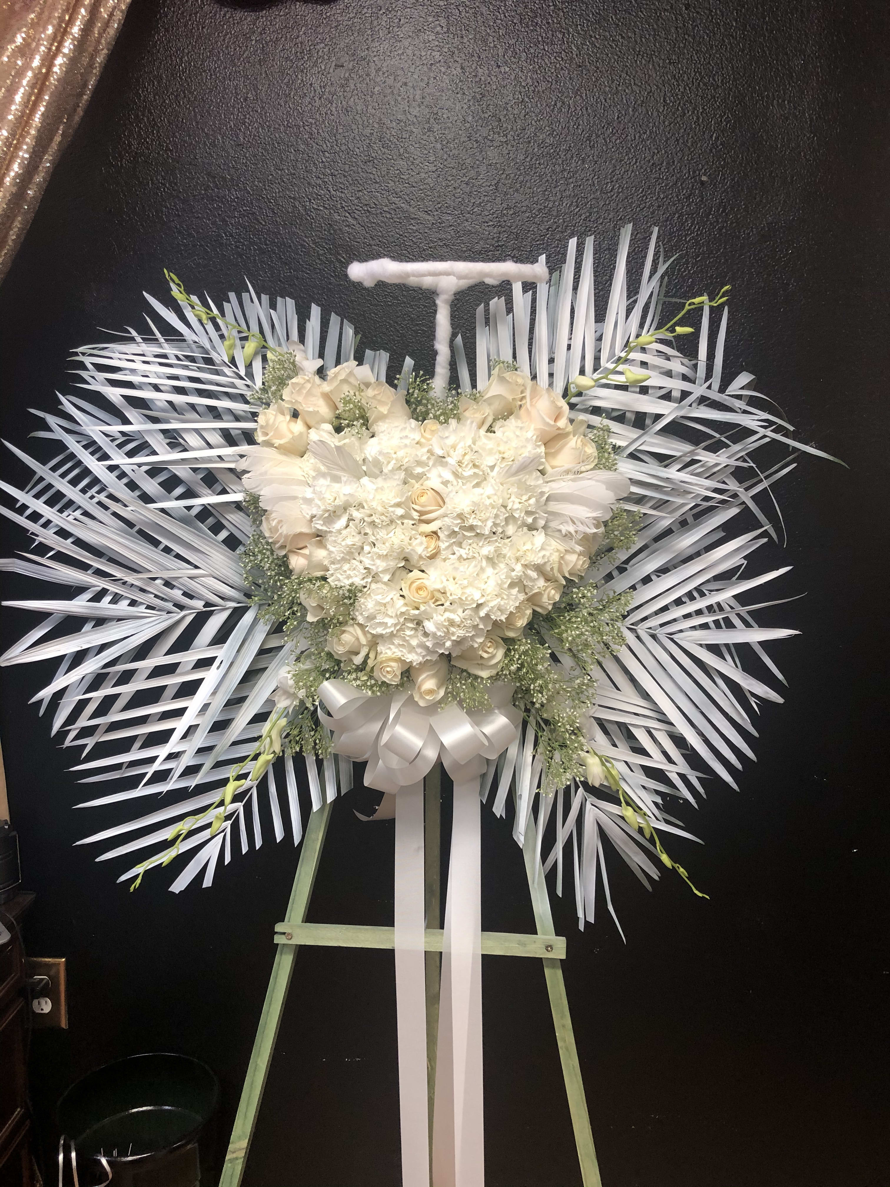 My little angel standing spray - White roses ,white carnation .babys breath palms 