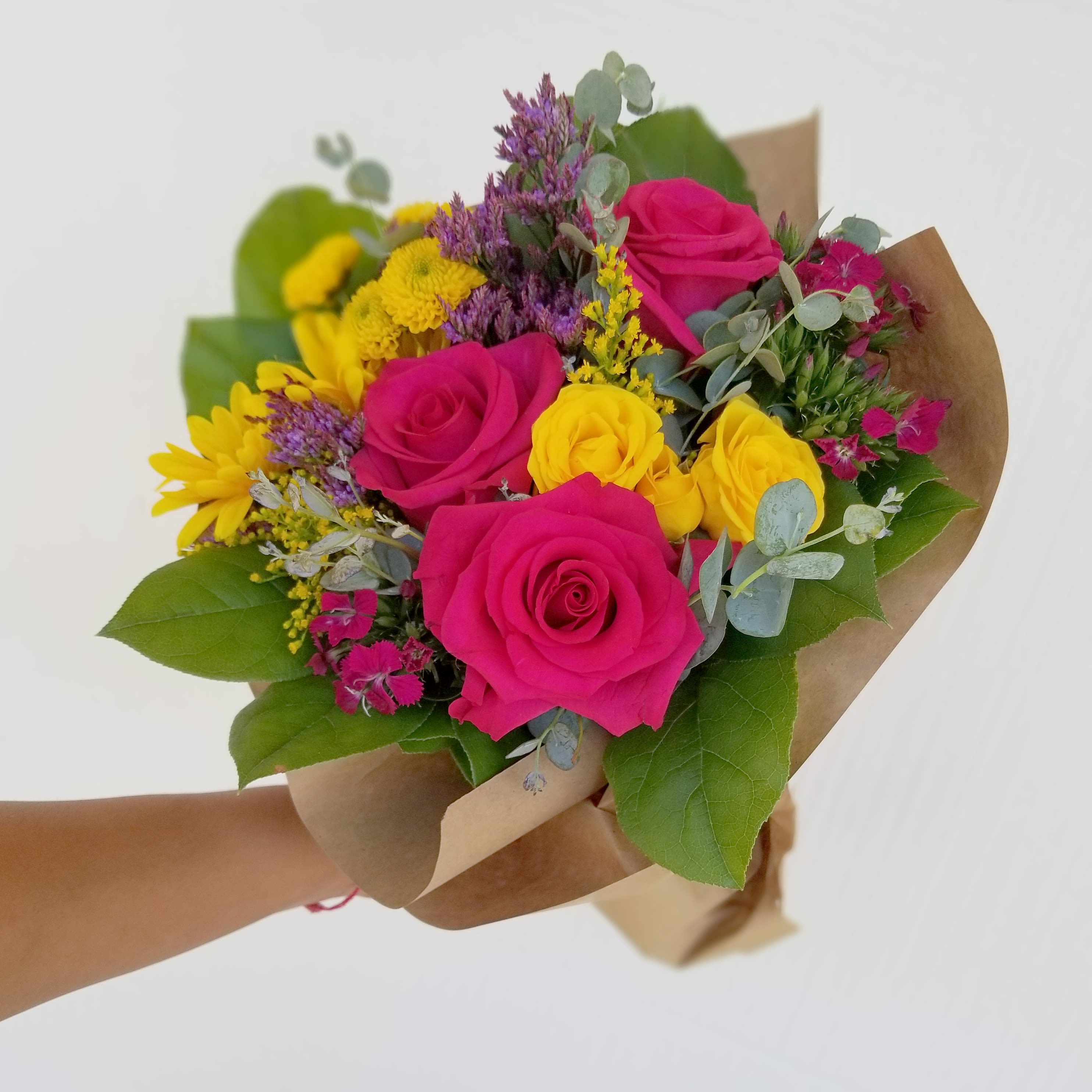 Scottsdale Mini color burst wrapped bouquet  -  Flower perfection in a bouquet. Vibrant colorful mix of seasonal flowers   This arrangement does not come arranged in a vase.   Each upgrade adds more flowers for a fuller wrapped bouquet.    Available as a vase arrangement,  please use custom order option or call to order 