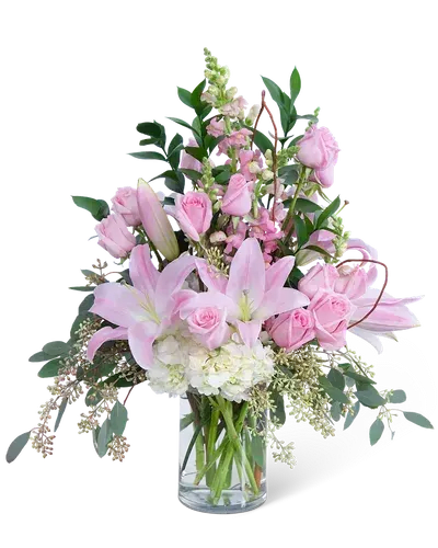 Always and Forever - A luxurious floral arrangement, hand-delivered to her door will always bring a smile. Celebrate the one you love by sending this beautiful and cheerful design. Always and Forever features delicate pink roses, lilies, hydrangea, Snapdragons, premium foliage, and a whimsical curly willow accent. It's the perfect gift for any occasion and will make someone's week, as it will have long-lasting blooms, brightening their home.