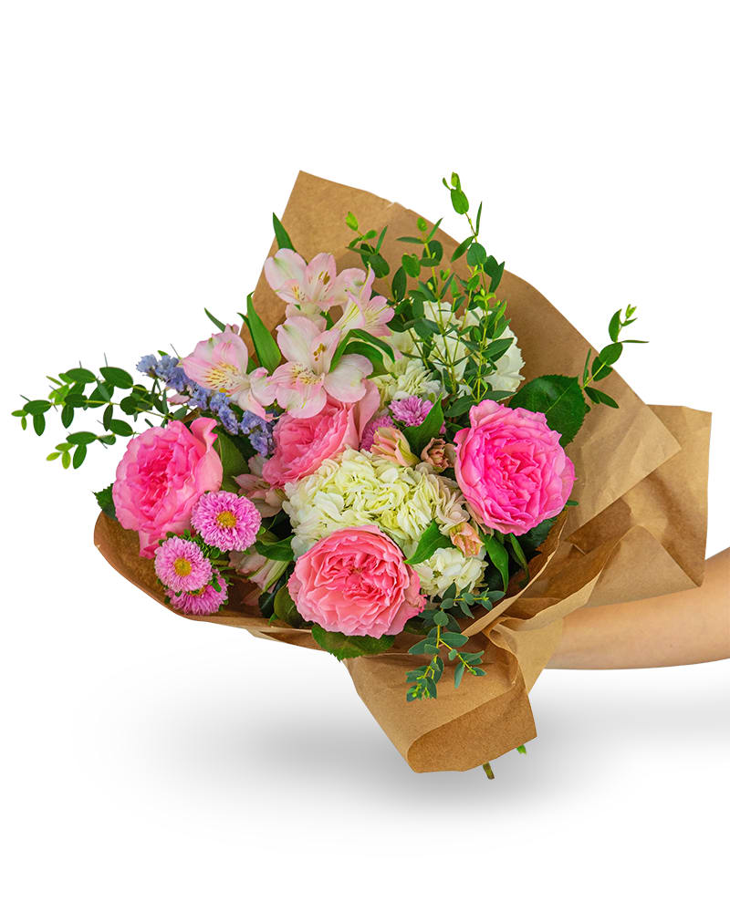 Cloud Nine Bouquet - Our Cloud Nine Bouquet features gorgeous roses, soft pastel hydrangea, Matsumoto asters, alstroemeria, and premium foliage in a hand-wrapped bouquet. This soft pink hand-tied bouquet is the perfect gift for a friend, family member, or for yourself! Shop your local florist for the freshest and longest-lasting flowers and flower bouquets for your table.